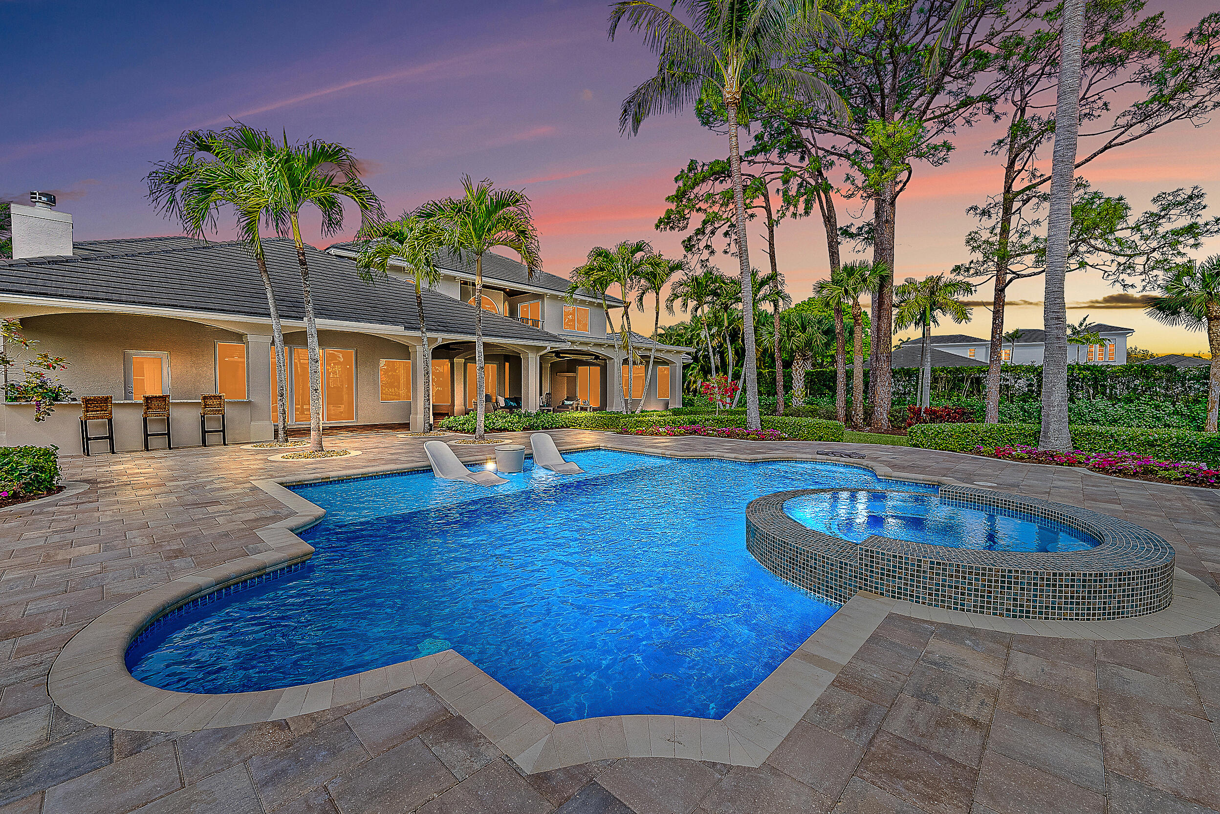 Welcome home to this Luxurious Private Estate, nestled in the prestigious gated community of Steeplechase. Recently undergoing a renovation with classic high-end finishes, and all the attention to detail flows throughout this 5 bedroom, 5 1/2 baths home with a separate guesthouse and a bonus room in the main house that can be used as you choose. Five generously sized bedrooms, each offering an oasis of tranquility. Two of the bedrooms share a Jack and Jill balcony which overlooks your pool, guesthouse and gardens. 2 laundry rooms, one on each floor of the home. A fully equipped guesthouse offers privacy for visitors, complete with a bedroom, bathroom, living room and kitchenette. Gourmet Kitchen, a chef's dream, features state-of-the-art appliances, custom cabinetry (See Supplement)... and brand-new Viking appliances. Outdoor Oasis, manicured gardens, a sparkling pool with hot tub, with new built-in sun shelf for your lounge chairs, an outdoor kitchen, and ample space for entertaining. Steeplechase offers unmatched privacy and security, with 24-hour manned-gated access and lush surroundings.