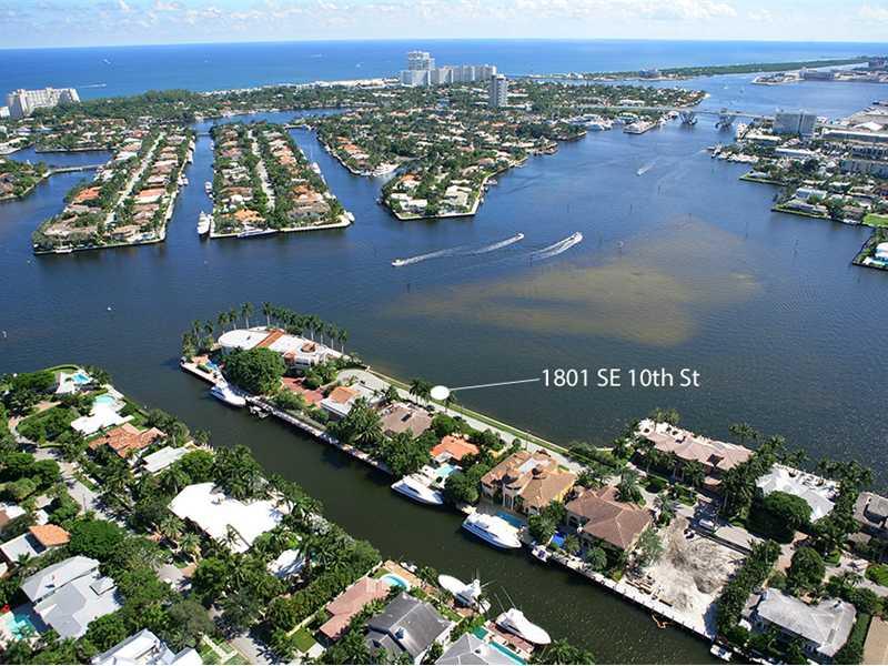 Direct Views on Widest Expanse of the Intracoastal to 17th Street Causeway. 100 Ft Dockage for 80 Ft Yacht. Three Story Design is Walled & Gated with Impact Glass & Doors. Elevator to All Levels. Marble & Wood Floors. Great Room has Coffered Ceiling & Sto ne Fireplace. Media Room has Surround Sound. Library with Corbeled Ceiling. Family Room has Custom Cabinetry & Built-In Bar. Master Bedroom has His & Her Marble Bathrooms, Two Walk-In Closets, Whirlpool Tub, Steam Shower, Wide Water Views.