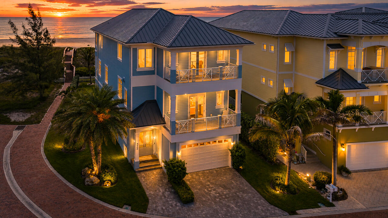 Welcome to Watersong's premier residence, set on the community's only oversized homesite with a private dune crossover providing direct access to one of the Treasure Coast's most beautiful beaches. This semi-furnished 4-bedroom, 5.5-bath home with a private elevator is built with all-concrete construction and features Andersen windows and doors, custom Wood-Mode cabinetry, marble and porcelain flooring, crown molding, and designer finishes throughout. The gourmet kitchen offers Thermador appliances, double wall ovens, quartz countertops, oversized refrigerator and freezer columns, and a spacious island. With room for a custom pool, this move-in-ready home delivers an exceptional blend of luxury, quality, and coastal living.