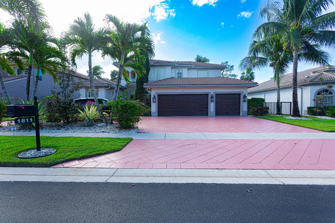 Beautiful two-story home located in The Estates at Madison Green golf community. Ideal as a primary residence or seasonal home, this spacious property offers 5 bedrooms plus a den/office, 4 full bathrooms, formal living and dining rooms, and a large family room with an open-concept kitchen. The home features a 3-car garage and a private backyard with a screened-in heated pool and jacuzzi, overlooking peaceful golf course views. Residents enjoy access to a community pool and on-site restaurant, all within a well-maintained golf community offering the best of the Florida lifestyle.