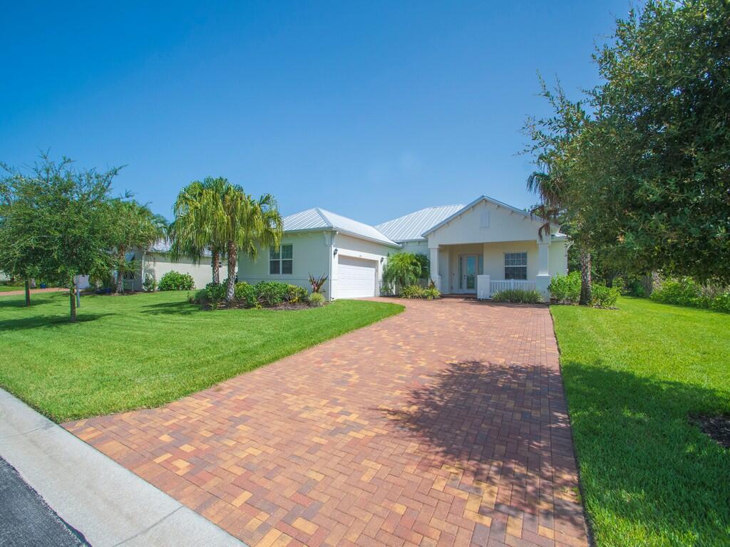 Built in 2021, this 3-bedroom, 2-bath home offers 2,200 sq ft of luxury. The open layout allows for seamless entertaining while the quartz countertops, stainless Kitchenaid appliances, tile flooring, tray ceilings, and a covered lanai dazzles. Just minutes from Vero's pristine beaches, shopping, dining, and everyday conveniences, this home is located in the gated, resort-style Antilles community. Lawncare and access to a well-appointed clubhouse, fitness center, pickleball and tennis courts, and a playground are all included.
