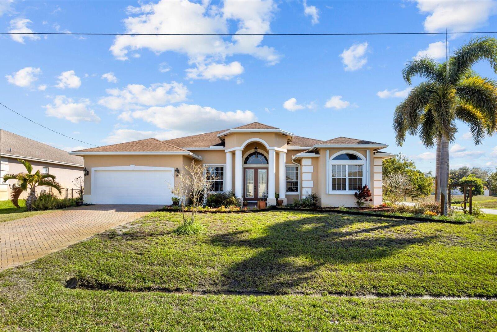 Move in Ready, well maintained 4/3/2 with City Water and Sewer on a quiet larger corner lot, in proximity to the Martin County Line. Drainage canal on the back offering extra privacy. New HVAC 2018, new water heater 2024. This house features an ensuite, high ceilings, tile and engineered wood floors, granite countertops and stainless steel appliances, a shed, a fenced backyard with a double gate, above the ground Jacuzzi Tub. Quick and easy access to I-95 and Turnpike, as well as the boat ramp with ocean access. Close to restaurants and shopping. A MUST SEE!
