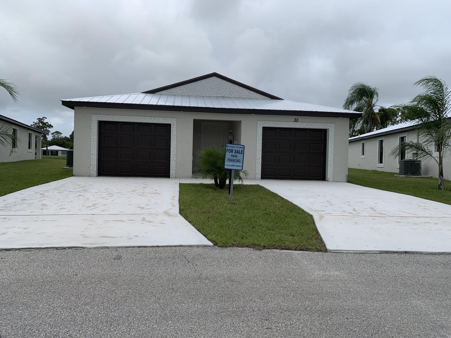 Our most Popular Model: The Windsor offers unmatched value with 3 full bedrooms, 2 baths, and a  car garage + golf-cart garage. Enjoy high vaulted ceilings, a chef's kitchen with a large island, and open concept living perfect for entertaining. Built for comfort and peace of mind with solid block construction and impact windows. Whether you're relaxing at home or enjoying the clubhouse, golf course, or pickleball courts, this home delivers the 55+ lifestyle you've been dreaming of. All models are built with 3/16th true plywood roof sheathing, hurricane tie straps, R-30 insulation, & hip roof designs ensuring big insurance premium discounts. Our homes are equipped with all energy efficient appliances. Land Lease is $729/mo. & includes all amenities, trash service & basic lawn maintenance.