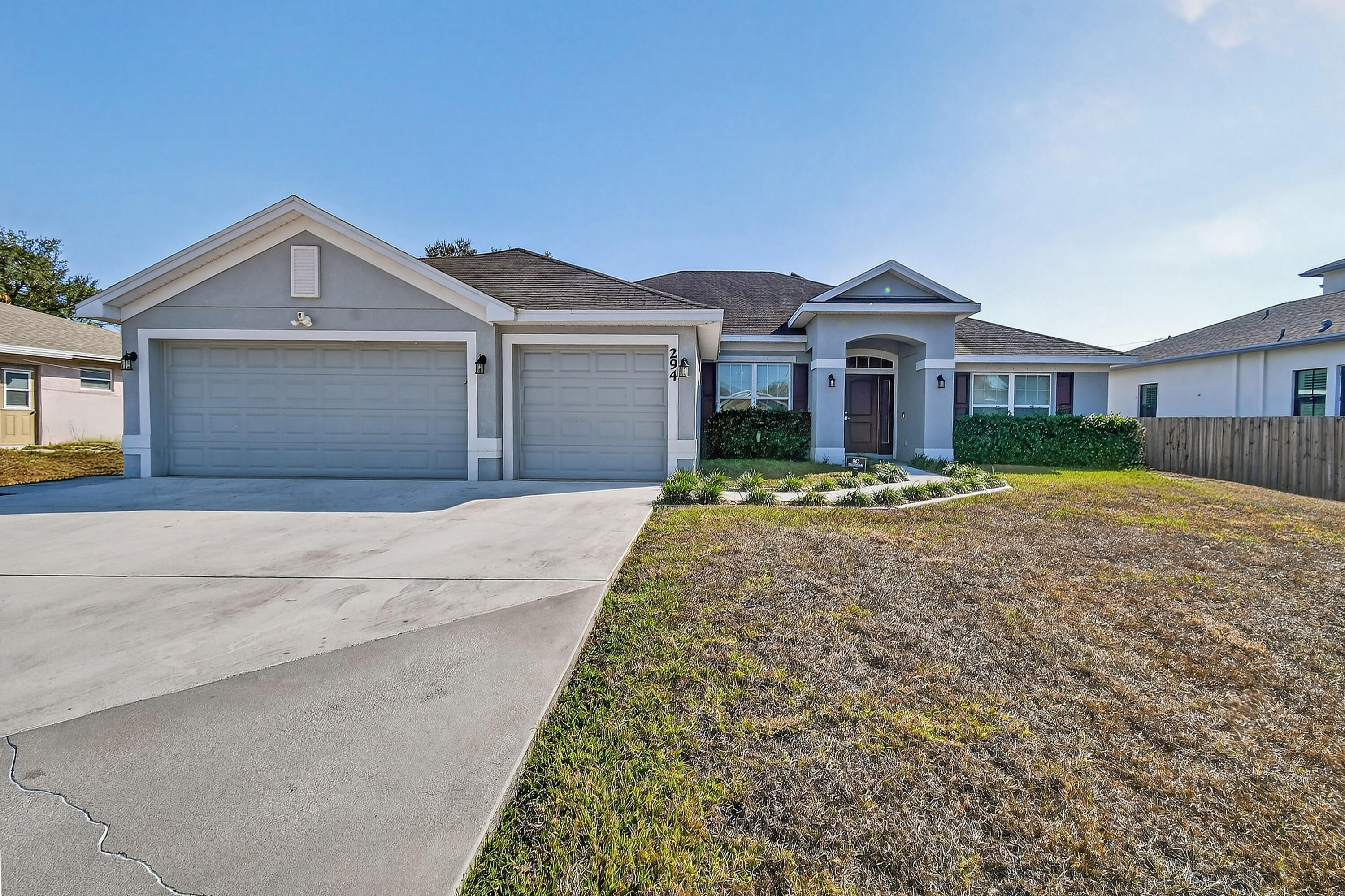 BETTER THAN NEW CONSTRUCTION 2018 CBS — with SOLAR panels PAID BY SELLER at closing! Enjoy ~$36/mo electric bills!  Spacious 4-bedroom, 3 bath, + Den with a 3-car garage in Port St. Lucie close to the Turnpike interchange. This must-see property offers a generous layout with split plan featuring a formal living room, dining room, and a convenient cabana bath that opens to the lanai — perfect for indoor outdoor living and a pool. The home includes upgraded finishes throughout stainless-steel appliances, upgraded cabinetry with crown molding, dual pane Low vinyl windows, 5¼'' baseboards, lever style door handles, and rocker style light switches. The main living areas and two bedrooms feature wood laminate flooring, while the primary suite and an additional bedroom offer cozy carpeting.   Enjoy a large, fully fenced backyard complete with a storage shed for all your extras.  This home is ideal for a growing family and ready for its next chapter.  Seller will pay off the solar panels at closing.