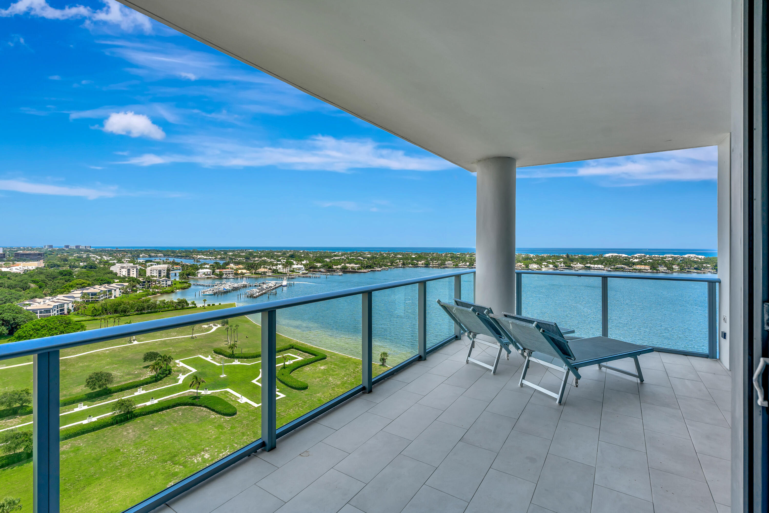 Experience elevated waterfront living from the 17th floor at Water Club North Palm Beach, where unobstructed panoramic views stretch across Little Lake Worth, the Intracoastal Waterway, and the Atlantic Ocean. This contemporary luxury residence offers the perfect blend of sophistication, comfort, and resort-style living in one of South Florida's premier waterfront communities. Privately keyed elevators open directly into the residence, revealing sleek modern interiors designed with refined finishes throughout, including porcelain flooring, quartz countertops, custom cabinetry, and floor-to-ceiling impact glass that fills the home with natural light while framing breathtaking water views from nearly every room. The expansive balcony serves as an extension of the living space, creating the   ideal setting for morning sunrises, evening cocktails, and year-round outdoor enjoyment overlooking the waterways from the Intracoastal to the Atlantic. Water Club's exceptional amenity package rivals that of a five-star resort, featuring multiple heated swimming pools, Jacuzzi spas, a state-of-the-art fitness center, pickleball courts, club rooms, sauna and steam facilities, and climate-controlled parking. The community's three architecturally striking towers offer a private, secure, and luxurious lifestyle in the heart of North Palm Beach. Priced attractively and ready for immediate occupancy, this residence presents an incredible opportunity just minutes from the area's finest shopping, championship golf, private clubs, tennis facilities, marinas, and world-class dining.