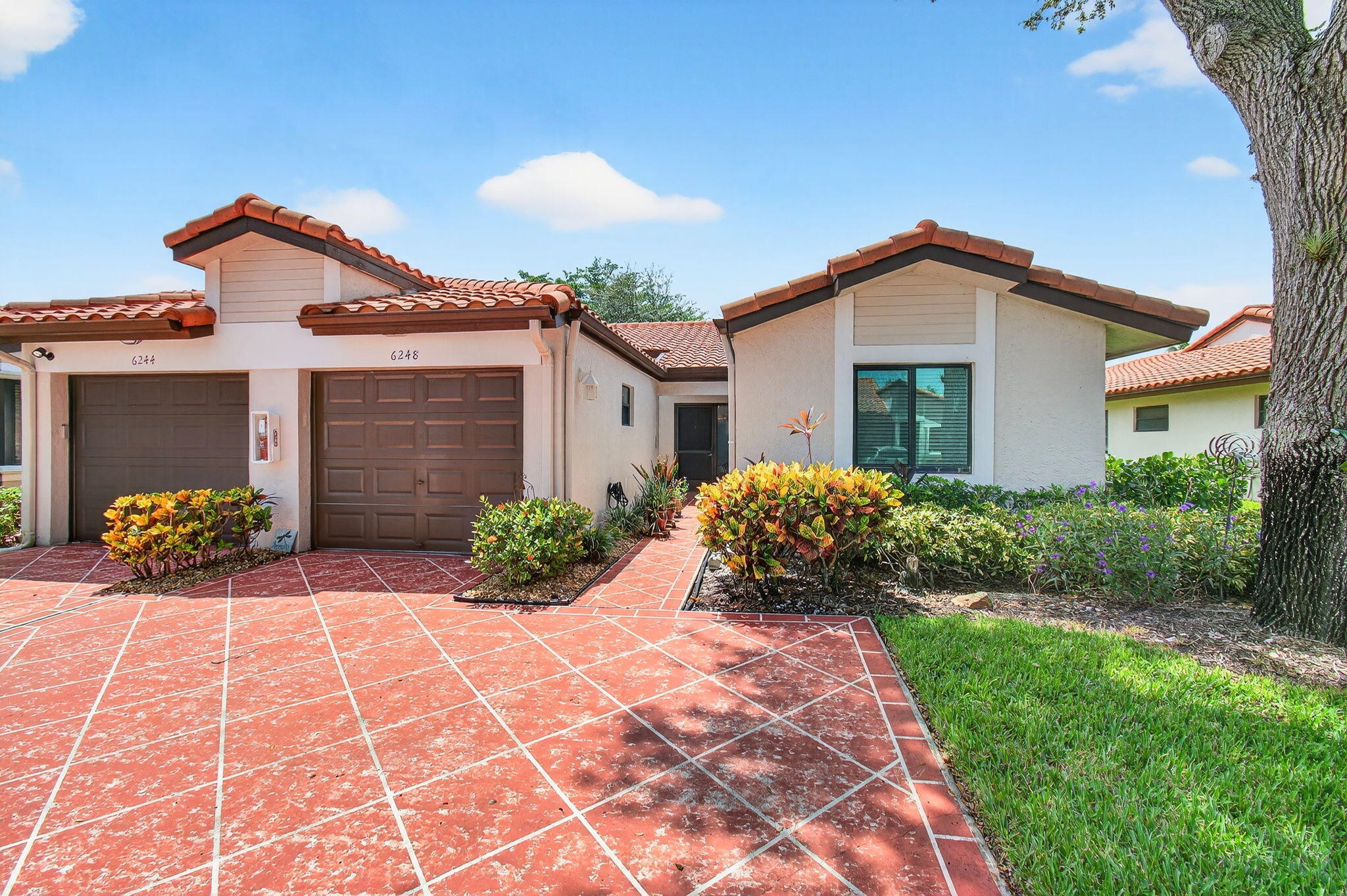 Brand new 20K tile roof was just installed. This unit has been completely renovated, neutral colors. Beautiful kitchen with island. Double sink in main bathroom. Pull out drawers in the kitchen, light grey large ceramic tiles throughout. Lots of closet space, top of line. Just bring your tooth brush and move in. 1 car garage and 2 parking spaces in front. Very active, 55+ community with all amenities, including a clubhouse, indoor and outdoor swimming pools, tennis, pickleball, fitness center and cafe. 24 hour guard gated community.
