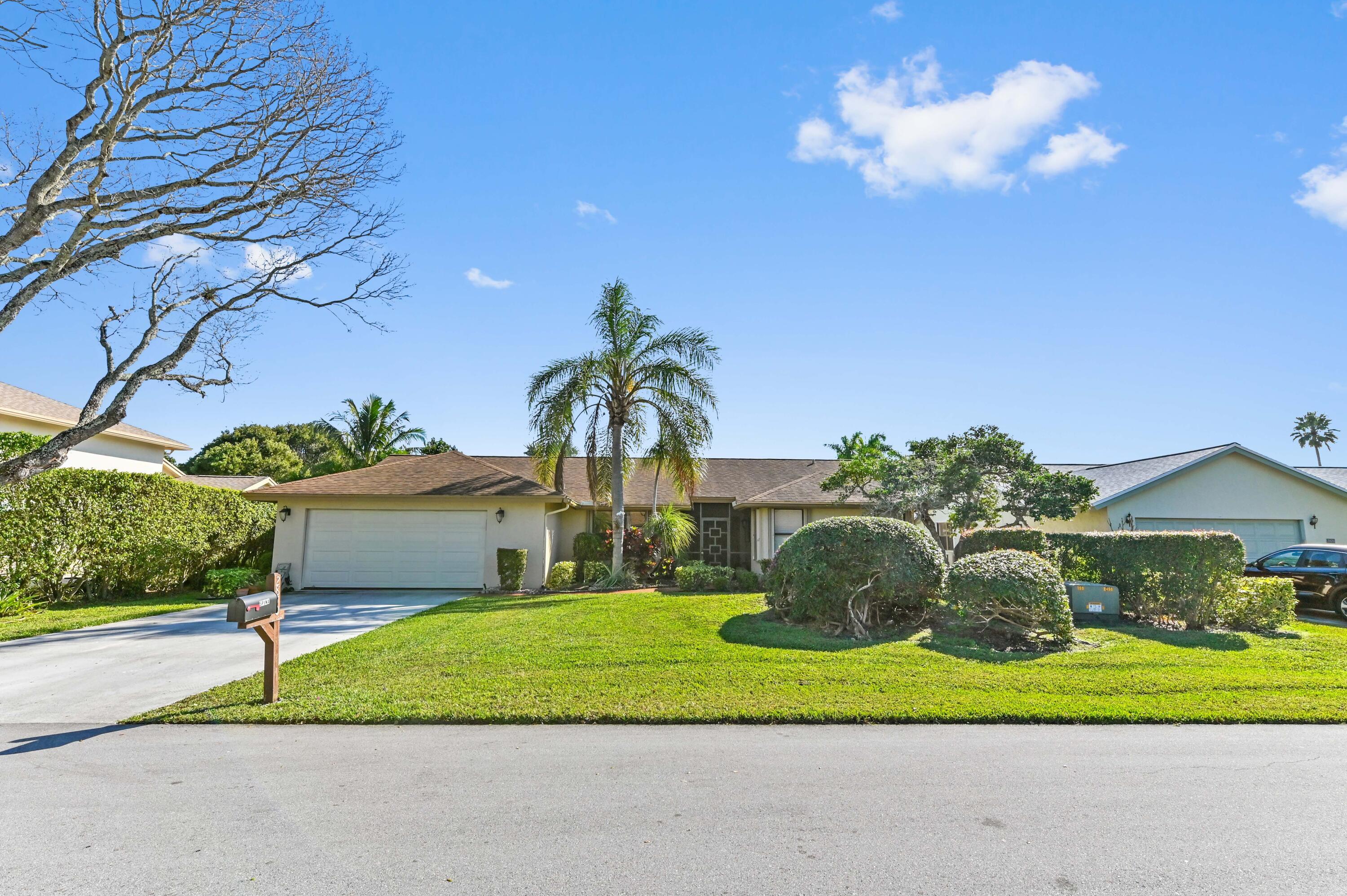 Discover the perfect blend of comfort and convenience in this beautifully updated 2-bedroom + den, 2-bath home in Rainberry Bay, a sought-after manned, gated 55+ community just minutes from the beach and downtown Delray Beach. Bamboo flooring flows throughout, complementing the updated kitchen and renovated master bath with dual sinks and a walk-in shower (no tub). The guest bath has also been tastefully redone. Accordion shutters, an impact-rated garage door, and a newer A/C (2019) provide peace of mind. A washer and dryer in the garage and a newer water heater (2019). Rainberry Bay offers incredible value with resort-style amenities, including five pools, tennis, pickleball, and more!