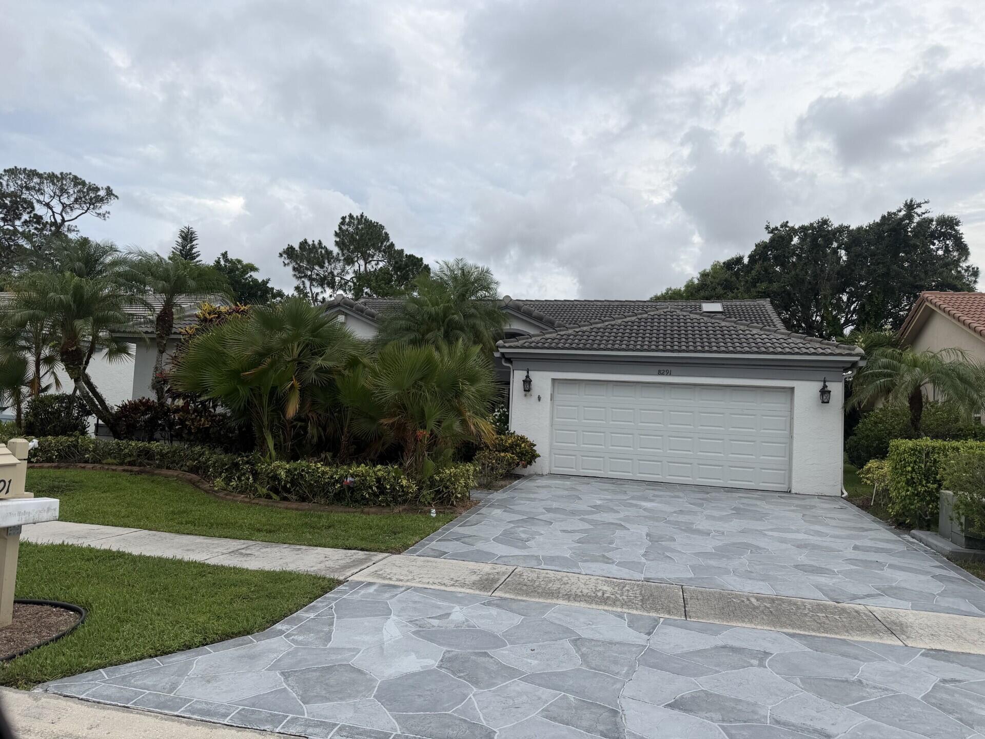 Welcome home! Enjoy everything South Florida has to offer in this beautiful 3 bedroom 2.5 bathroom with 2,353 sq.ft. of living space. This gorgeous home with 2 car garage, extremely spacious layout, vaulted ceilings, screened in patio, that overlooks nothing more than the beautiful landscaping w/ no neighbors behind you! You'll be stunned by the beautiful kitchen, gorgeous decor, and updated appliances. This community, located in picturesque Palm Beach County Florida, has the most golf courses of any county in the US! With 160 courses, you'll find the most challenging and well renowned courses you've ever played!   Stay within this active adult community and enjoy the tennis courts, exercise room, card room, Pickleball, shuffleboard, spa, or the refreshing resort style pool & Clubhouse. Or venture out into the city where you're moments away from exquisite dining downtown, the Kravis Center, shopping on Worth Avenue, or our beautiful beaches.  For those that love horse sports, the National Polo Center and the Wellington International show grounds are close by this is where the top equestrians participate in some of the most prestigious competitions in the world! Don't miss this opportunity to own a home where most can only dream of living! MORE PHOTOS COMING SOON!