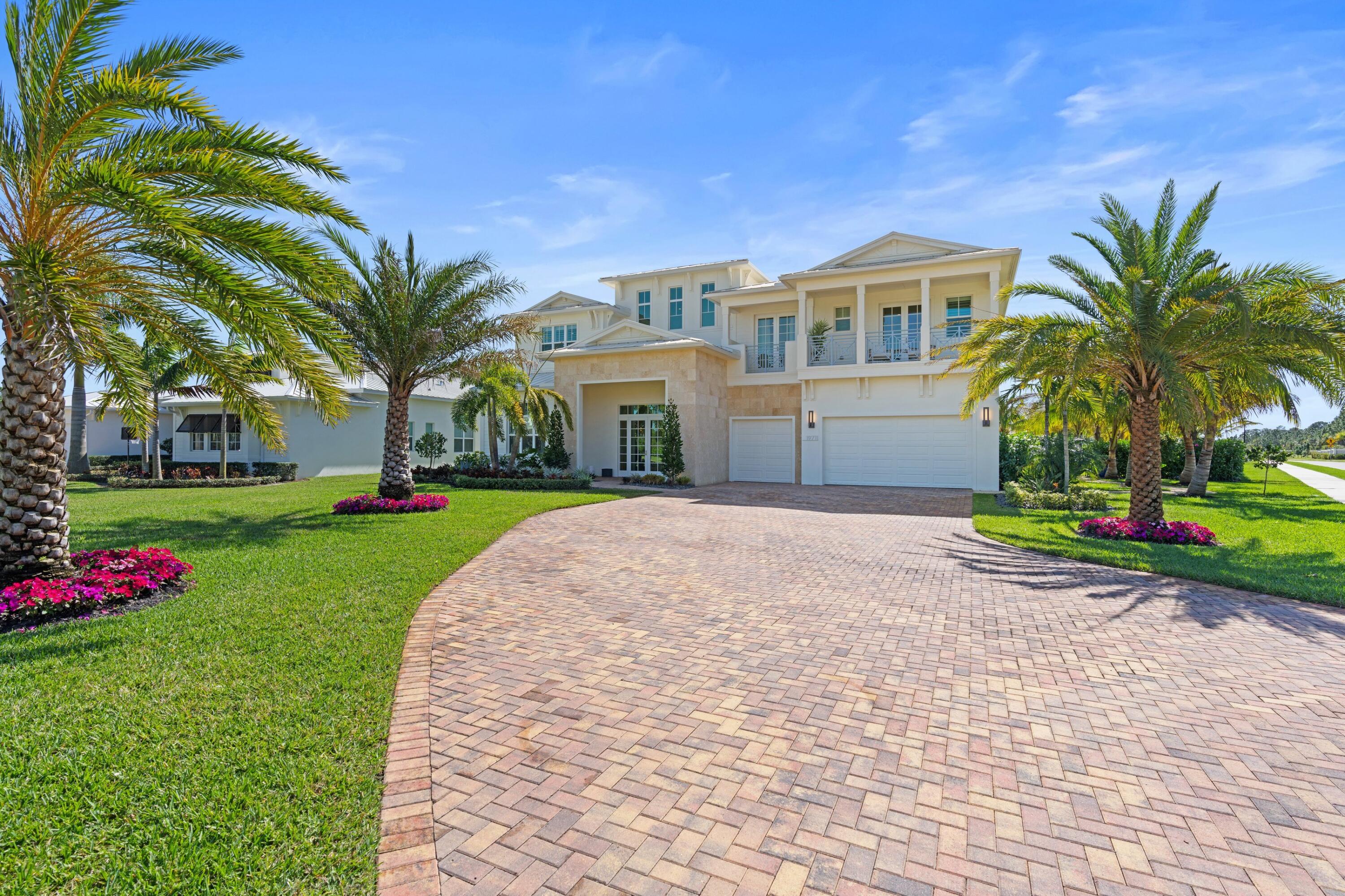Welcome to 19711 SE Gallberry Dr in Jupiter FL located in Martin county. Spanning just under an acre, this designer finished home features Five bedrooms, each boasting an en suite, totaling five full baths and two half baths. The main level fifth bedroom has been converted to an in home gym, Office with custom built in desk & Theater/bonus room equipped with surroundsoundCreston system speakers throughout the home
Upgraded white oak, wood flooring
Upgraded tile in all baths, quartz countertops, seamless glass shower, marble tile in master shower and extra large freestanding soaking tub
Custom mill work throughout the home 
The kitchen features a 
Quartz waterfall kitchen island 
Upgraded GE monogram appliances
Pot filler, pull out drawers and furniture baseboards to cabinetry, custo upper cabinets. Custom 300 gallon saltwater fish tank 
custom closets, pantry, office, mudroom
All impact glass windows feature custom roller screens, plantation shutters and drapes. Designer, Serena and Lily lighting throughout the home. Complete Three car garage with electrical charging for vehicle, storage system and ceiling storage for all holiday decor or extra circular activities. White sandblasted marble pool deck features a lattice turf design Large custom built pool with champion pools, extended sunshelf and baby gate Fire pit lounge seating surrounded by coconut palms Playground