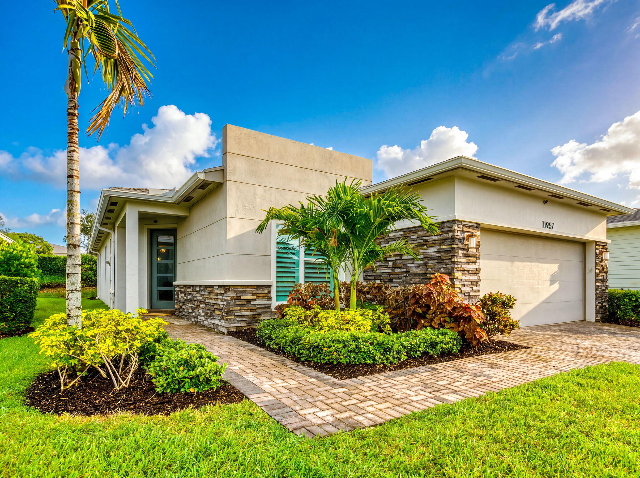 RARE OPPORTUNITY! Approximately $284,418 of the existing mortgage is assumable at an incredibly low 3.25% interest rate, offering qualified buyers the chance to secure significant monthly savings in today's market.  Welcome to 11957 SW Lyra Drive in the desirable Manderlie community of Port St. Lucie! This beautifully upgraded, like-new home offers 2 bedrooms, 2 full bathrooms, and 1,724 square feet of thoughtfully designed living space in a warm, friendly, all-ages neighborhood.  From the moment you enter, you'll appreciate the elegant Level 5 tile flooring that flows seamlessly throughout the entire home. High-hat lighting and pre-wiring for ceiling fans provide both style and convenience, creating a bright and inviting atmosphere. The gourmet kitchen is truly a showpiece, featuring  Listing information is subject to error, omission & changes without notice. 24 hr notice to show. Buyers Agent is responsible for qualifying their Buyer with Proof of Funds or Complete Mortgage appr.