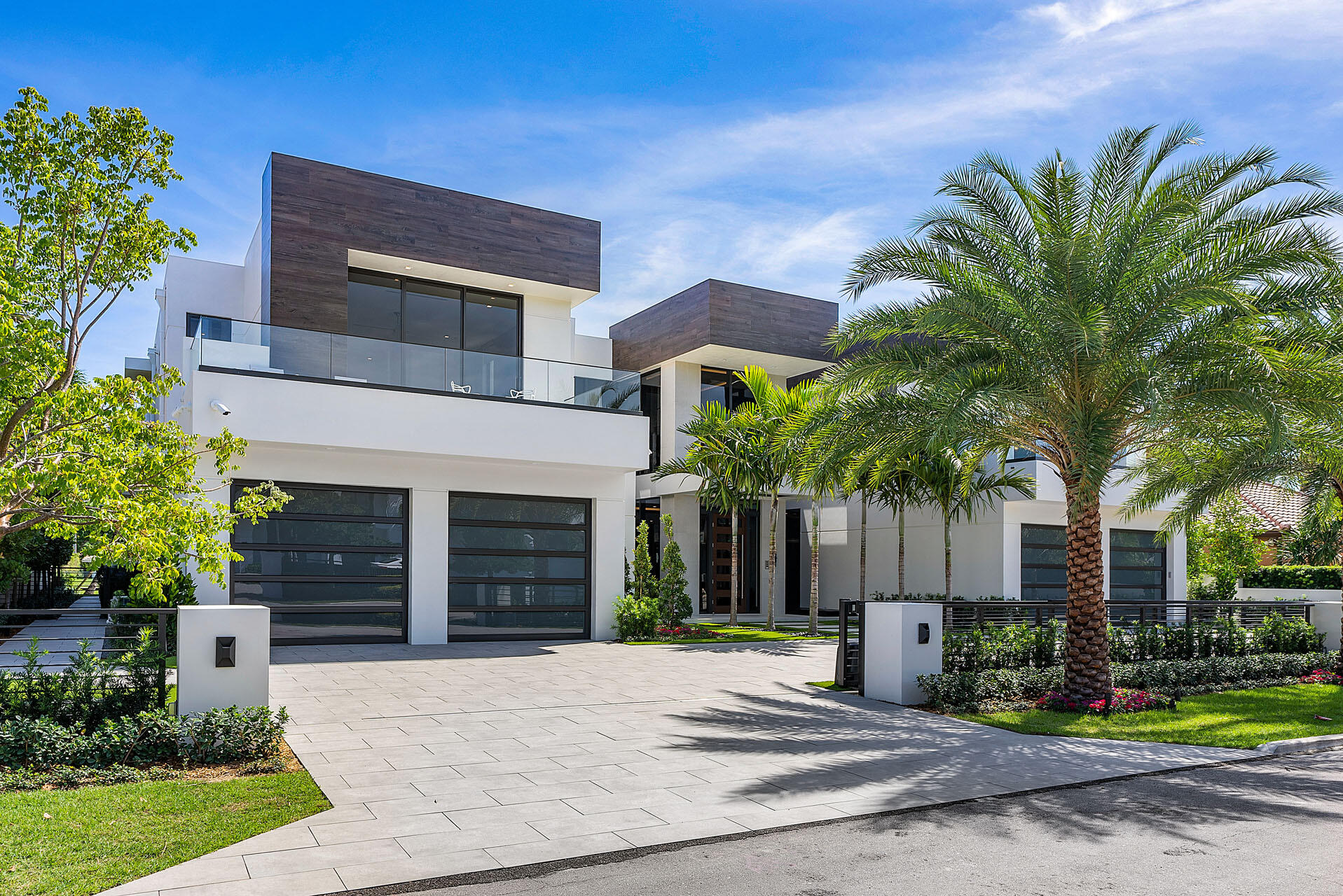 Welcome to 500 Alexander Palm Road-an Intracoastal turn-key Signature Estate by SRD Building Corp, perfectly positioned within Royal Palm Yacht & Country Club, Boca's most coveted community. Built in 2022, the home spans more than 8,200 square feet of beautifully designed, open, and airy living space. The five-bedroom residence features a 4-car plus golf-cart garage, a resort-grade pool and outdoor retreat, and 100 feet of premier Intracoastal frontage complete with a private dock and Jet Ski lift. Enhanced by full Crestron smart-home automation, advanced security features, and meticulous craftsmanship throughout, the property is offered fully furnished by the award-winning P&H Interiors--creating a seamless, move-in-ready waterfront experience.