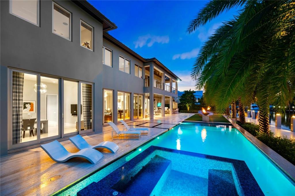 The very best of Modern architecture & design located in highly desirable/security patrolled Seven Isles! Shows as new!Well thought out, immaculate custom built owner/developer's personal residence! Dock your 92ft boat legally-112ft dock/canal width 90ft/depth 6ft+/-. Incredibly flexible, creative & welcoming floorplan offers expansive Great Room, Snaidero Chef's kitchen & wine bar, SubZero/Miele appliances, elegant dining room, movie theatre, full home automation, LED lighting elevator, gym area,2 laundry rooms, air conditioned garage.All expansive bedroom suites with sitting areas/custom closets.Ultra-luxurious Master Wing-3 room configuration potential office/gym/nursery.Large covered loggia,Summer kitchen/bar, dining & lounge area, misters.Private resort style pool area & concrete dock - Additional 800 sf finished attic for storage- Residence walled and gated- Professionally landscaped with artificial grass around the pool area- Custom closet systems, window treatments & lighting- Hand selected stone & porcelain accents throughout- Master Suite has two double door entrances for flexibility & privacy- Advanced security & camera system