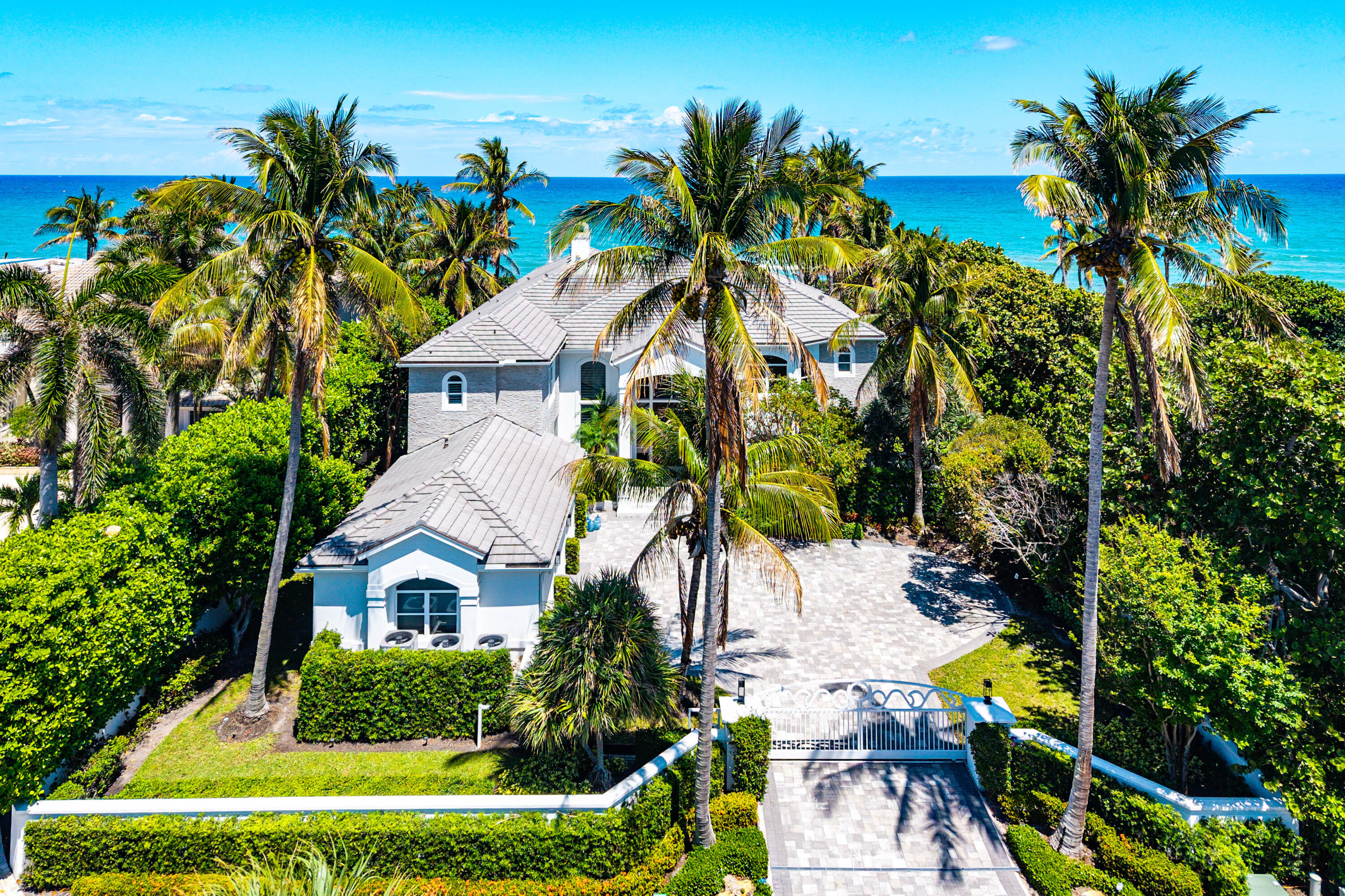 Envision Paradise through this amazing opportunity in Ocean Ridge! Exclusive Beach front compound behind its own private gates is nestled on its own private drive with just four houses on the street. Sitting on half an acre of land and just about 7,000 SQ FT under air, this is home awaits the finishing touches from its new owners.
