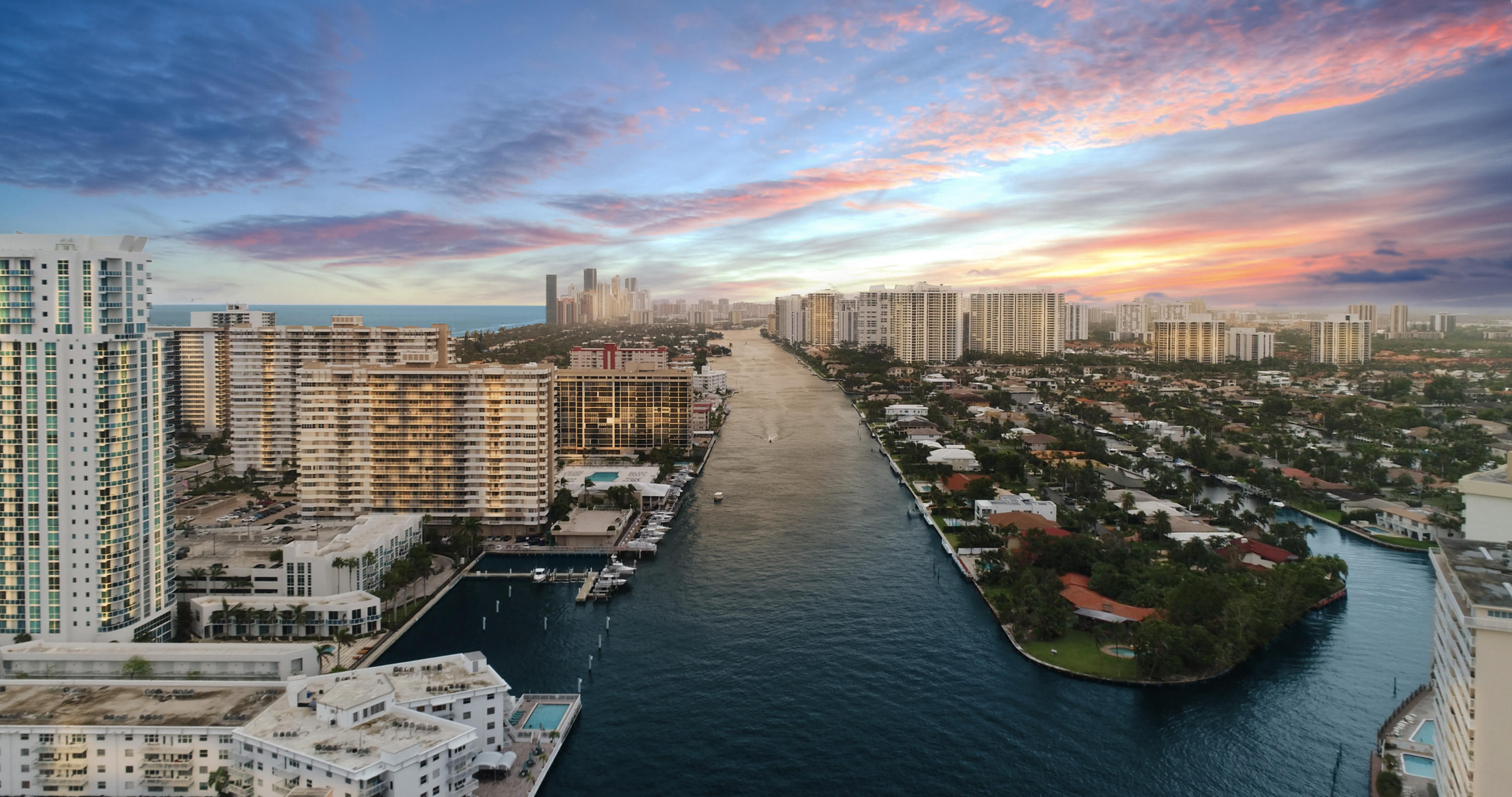 A GOLDEN opportunity! This private peninsula is graced by panoramic views of aquatic grandeur with close to an acre of land!  Move in immediately, add a personal touch with custom renovations, build a second level for more sparkling water views, or subdivide this point lot to build 2+ homes … a developer’s dream. Boaters will covet the canal’s depth of 10 ft and a massive seawall, about 558 linear ft!  This is a rarity – one of the largest deepwater properties in Broward County. With more than 230 ft of seawall on the canal side, a sizable yacht won't interfere with Intracoastal views. A Chicago brick circular driveway leads guests to a timeless 1-story estate, framed by tropical landscaping. Golden Isles affords the safety of a manned gate, no HOA, and the convenience of local amenities! Amenities include nearby playground, walking trails, basketball court, beaches, upscale shopping, fine dining, arts and entertainment, casino ... hallmarks of luxurious living in South Florida.