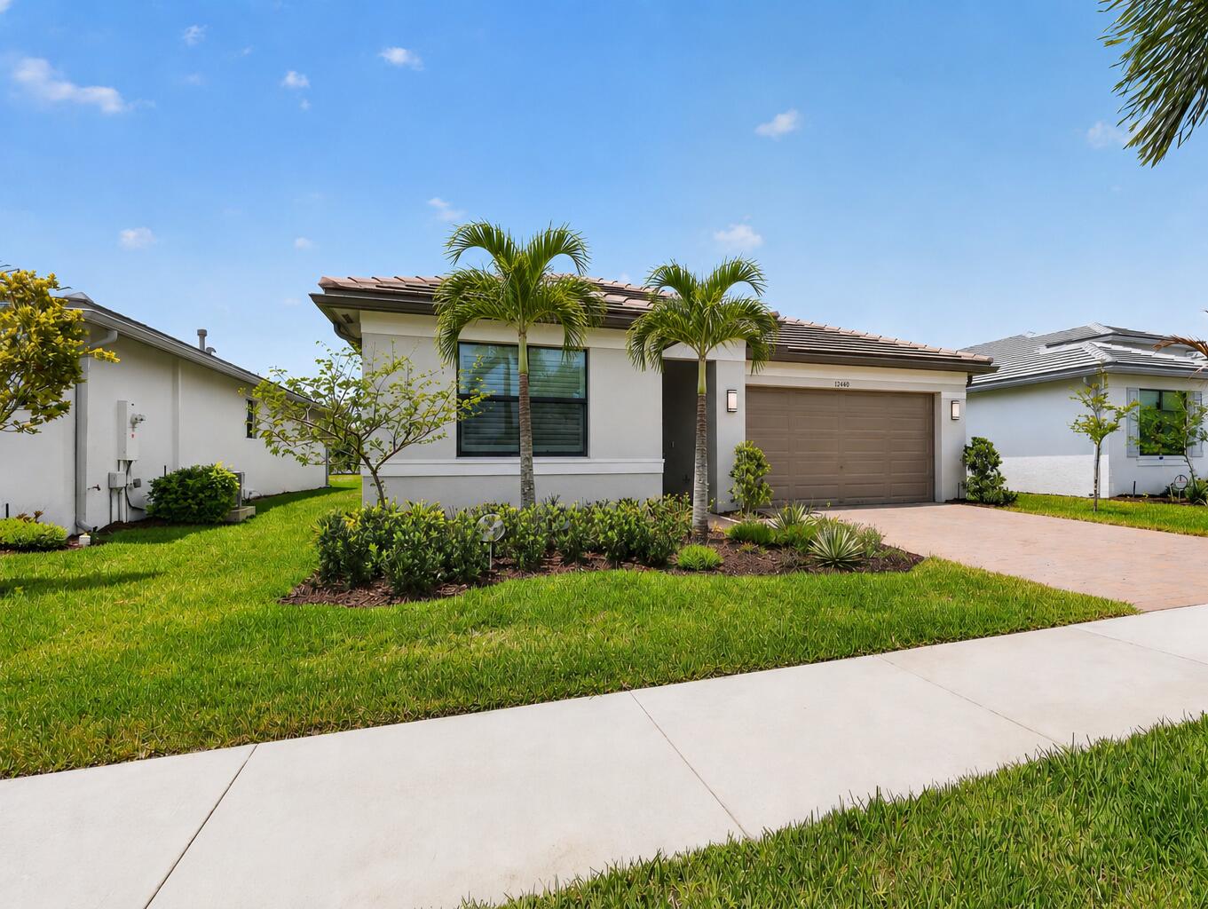 FOR SALE in GL Homes 55+ Valencia Walk at Riverland in Port Saint Lucie, FL. Don't wait months to build when this move-in-ready Sandpiper is available now! One of GL Homes' most sought-after floor plans, this residence offers 1,752 square feet under air with 2 bedrooms, 2 bathrooms, and a flexible den that can easily function as a third bedroom, office, or media room. Thoughtfully upgraded throughout, the home features a stylish kitchen with Brazilian Black countertops, a finished refrigerator cabinet panel, vented microwave, and wiring already in place for pendant lighting. The spacious primary suite offers upgraded finishes and practical touches, including pocket doors to both closets and enhanced bath fixtures. Additional highlights include tile flooring in the den, added recessed   lighting, upgraded carpet padding in the bedrooms, and a laundry room with a utility sink.  The guest bath has been thoughtfully updated with an upgraded countertop, fixtures, and a glass shower door above tub. Enjoy outdoor living on the screened lanai with extended patio pavers, a ceiling fan, and professionally designed tropical backyard landscaping that offers both beauty and privacy. Custom plantation shutters and motorized shades provide style and convenience throughout the home. Ideally located with easy access to Riverland Square, Publix, the Paseo, and the Sports & Racquet Club. Valencia Walk at Riverland offers a true resort lifestyle with a spectacular clubhouse, multiple pools, a state-of-the-art fitness center, tennis, bocce, and one of the largest private pickleball facilities in the country, featuring over 50 courts, including covered courts for year-round play. Residents enjoy a vibrant social calendar and an exceptional full-service restaurant right in the community, while the surrounding area offers an impressive array of casual and fine-dining experiences just minutes from your door. Conveniently located near Cleveland Clinic Tradition Hospital, shopping and dining in Tradition, and Clover Park for Mets spring training, this home also offers easy access to golf, entertainment, and beautiful Treasure Coast beaches, all within an approximate 30-minute drive. This is an exceptional opportunity to enjoy the best of the Riverland lifestyle in a beautifully upgraded home. Call today to schedule your private showing and experience all that Valencia Walk and Riverland have to offer.