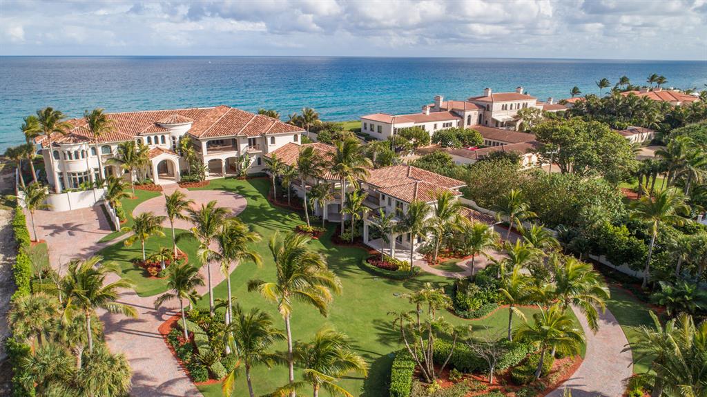 New Ocean-to-Intracoastal compound in the prized Estate Section is sublime and serene on 200± feet of beachfront and 200± feet on the waterway with dock. This seaside masterpiece brings the ideals of modern luxury to the classic Gold Coast tradition. Grand entertaining with a soaring great room,
multiple wet bars, club room, wine room, poolside ocean loggias. Sumptuous master wing, private guest house, 5 garage bays.The information herein is deemed reliable and subject to errors, omissions or changes without notice. The information has been derived from architectural plans or county records. Buyer should
verify all measurements Enchanting in an oceanfront dreamscape, this rare new compound offers the ultimate luxury in Manalapan's prestigious Estate Section between the Atlantic Ocean and Intracoastal Waterway.

Sublime and serene in the midst of the ocean's sights and sounds, this rare new compound spans 200± feet on the Atlantic Ocean, backed by another 200± feet fronting the wide Intracoastal Waterway, on the prized barrier island coastline of Manalapan's Estate Section, next to the landmark historic mansion built by Howard Stirling Vanderbilt, who chartered the town in 1931.
Bringing the ideals of modern luxury to the classic Gold Coast tradition, this seaside masterpiece on 2.14± acres was designed by Yates Rainho Architects, a Palm Beach-area firm with an award-winning global portfolio, and was just completed in 2018.

Lantern-lit gated entries give way to a long drive that winds along the sprawling front lawns to the stately six-bedroom main residence, while a second drive approaches the separate two-bedroom guest house.  Inside, fresh soft neutral tones refine the timeless living environment that discreetly integrates the advanced technologies and structural features.

By the spiraling staircase, the lofty foyer brings guests into the airy double-height great room, at once dramatic and understated, with a monumental wall of glass placing the attention on the inspiring ocean scene, and a statuesque fireplace as a focal point.  In this stunning space designed with entertaining in mind, cocktails can be served from the professional-style bar by the lounge area, opening out to the ocean loggia and pool by broad lawns that can expand the outdoor gathering space.

Accessed by either of the two elevators, the second floor features a sumptuous oceanfront master suite indulging in a fireside sitting area, romantic balcony, and two exquisite bath retreats.   Added luxuries of the estate include a five garage bays plus dockage for the boater in this exclusive Ocean-to-Intracoastal compound in one of South Florida's most prestigious communities, where residents also enjoy deeded privileges at the Five-Diamond Eau Palm Beach Resort & Spa and its La Coquille Club.

Location
South Ocean Boulevard, Manalapan, Florida.  Few places in the world rival the lifestyle of Manalapan, an idyllic oceanfront hamlet on the barrier island just south of Palm Beach. 

Property
An idyllic oceanfront paradise, this sprawling compound fronts 200± on the sugar-sand beach in an elevated site, protected by a massive seawall, and fronts another 200± feet on the Intracoastal Waterway equipped with a full-service ipe dock.  Sweeping lawns studded with palm trees present the main residence and guest house, and also stretch open from the breezy ocean loggias, served by a summer kitchen, next to the saltwater pool with flow-over spa.

Residence
At once classic and modern, this understatedly elegant residence provides a grand total of 23,795± feet  including the guest house  with eight bedrooms, twelve full baths, three powder rooms, walk-in closets, two elevators, three laundry rooms, and five garage bays.  There is exquisite millwork and impact glass throughout, and the floors are done in creamy Corsica marble and wide-plank walnut.  Leading-edge amenities include the full-house 150-kilowatt Kohler generator, Lutron LED lighting, electronically controlled window treatments, sophisticated security system, eight air conditioning systems, and four tankless water heaters.

First Floor:  Arched doors enter the two-story marble foyer and stunning window-walled oceanfront great room, anchored by a sleek fireplace across from the full-service bar.  Another fireplace highlights the oceanfront club room/library which also has a wet bar, as does the pre-wired theater room adjacent.  Looking out on the ocean and a garden fountain, the dining room flows off the oceanfront family/breakfast room where an island/bar separates the showpiece chef's kitchen outfitted with leathered and polished granite counters, a Dacor gas range with oven, two Dacor wall ovens, two Bosch dishwashers, and a Sub-Zero refrigerator/freezer.  There is an 1,100±-bottle connoisseur's wine room plus a butler's pantry, two powder rooms, and two full cabana baths.  Facing a private garden, the guest master suite features a bow-windowed sitting area, morning bar, and luxe bath.

Second Floor:  Open to the great room below, the oceanfront loft with wet bar and adjacent powder room has spiral stairs to the sensational rooftop observation deck.  Entered through a private vestibule with wet bar, the sumptuous master suite has a grand wing to itself.  Capturing spellbinding ocean views from inside and out on the private balcony, the walnut-floored bedroom is highlighted by a linear fireplace.  Exquisite stone finishes adorn the two master baths, one a salon-like retreat featuring a jetted tub, multi-head shower, and boutique-style wardrobe room.  The other bath also has a wardrobe room, and an exercise room is next to the master wing.  In the other wing, balconies open off the four bedroom suites and game room with bar.  Two of these bedrooms open to a glorious oceanfront balcony stepping down by the pool.

Guest House
Opening to loggias and balconies, this two-story residence has a living/dining room, kitchen, two bedrooms, and three baths.

DISCLAIMER: Information published or otherwise provided by the listing company and its representatives including but not limited to prices, measurements, square footages, lot sizes, calculations and statistics are deemed reliable but are not guaranteed and are subject to errors, omissions or changes without notice. All such information should be independently verified by any prospective purchaser or seller. Parties should perform their own due diligence to verify such information prior to a sale or listing. Listing company expressly disclaims any warranty or representation regarding such information. Prices published are either list price, sold price, and/or last asking price. The listing company participates in the Multiple Listing Service and IDX. The properties published as listed and sold are not necessarily exclusive to listing company and may be listed or have sold with other members of the Multiple Listing Service. Transactions where listing company represented both buyers and sellers are calculated as two sales. The listing company's marketplace is all of the following: Vero Beach, Town of Orchid, Indian River Shores, Town of Palm Beach, West Palm Beach, Manalapan Beach, Point Manalapan, Hypoluxo Island, Ocean Ridge, Gulf Stream, Delray Beach, Highland Beach, Boca Raton, East Deerfield Beach, Hillsboro Beach, Hillsboro Shores, East Pompano Beach, Lighthouse Point, Sea Ranch Lakes and Fort Lauderdale. Cooperating brokers are advised that in the event of a Buyer default, no commission will be paid to a cooperating Broker on the Deposits retained by the Seller. No commissions are paid to any cooperating broker until title passes or upon actual commencement of a lease. Some affiliations may not be applicable to certain geographic areas. If your property is currently listed with another broker, please disregard any solicitation for services. Copyright 2020 listing company All Rights Reserved.