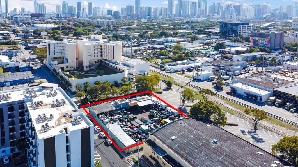 Rare assembled infill land position portfolio of 3 contiguous parcels (21,164 SF total) with a 3,709 SF freestanding building in Miami’s rapidly evolving 33127 corridor near Wynwood & Midtown. Parcels: 01-31-26-015-0010 (4,900 SF), 01-31-26-015-0020 (9,400 SF w/ building), 01-31-26-015-0030 (6,864 SF). Current Automotive/Marine use; owner open to 1–5 year leaseback, ideal for investors seeking covered-land income with future redevelopment upside. Potential to apply for mixed-use / multifamily (subject to municipal review & approvals). Site offers strong exposure, paved yard, fenced perimeter, functional lot layout, and excellent access to I-95, SR-112, Wynwood, Design District & MIA Airport. Priced as a covered-land acquisition below long-term redevelopment value.