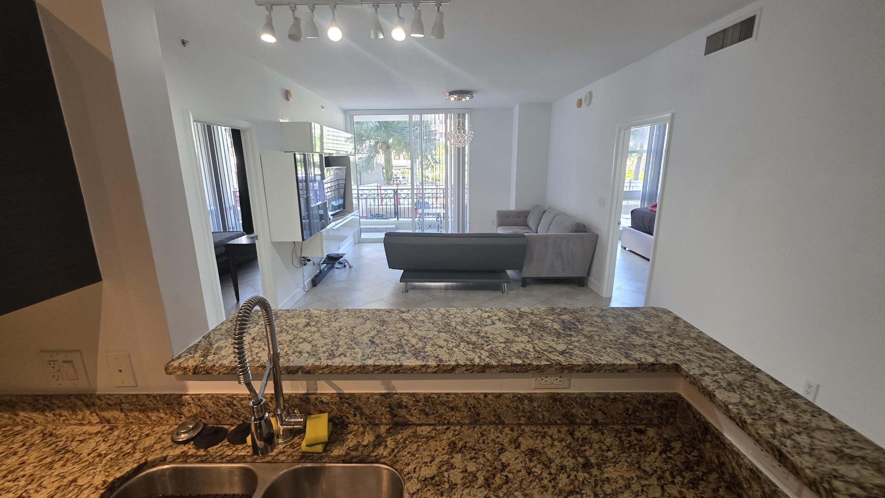 Experience the ultimate downtown lifestyle in this rarely available 2-bedroom, 2-bathroom residence at the CityPlace South Tower Building, Offering a blend of luxury and convenience, where you can enjoy an upscale, luxurious lifestyle in a meticulously maintained building that feels like a permanent vacation. This exceptional unit features a highly sought-after and rare double balcony (Extra Patio) overlooking the Artificial waterfall at the RH restaurant . Comes perfectly equipped with dedicated storage unit and two covered parking spots, providing unmatched convenience in the center of downtown.