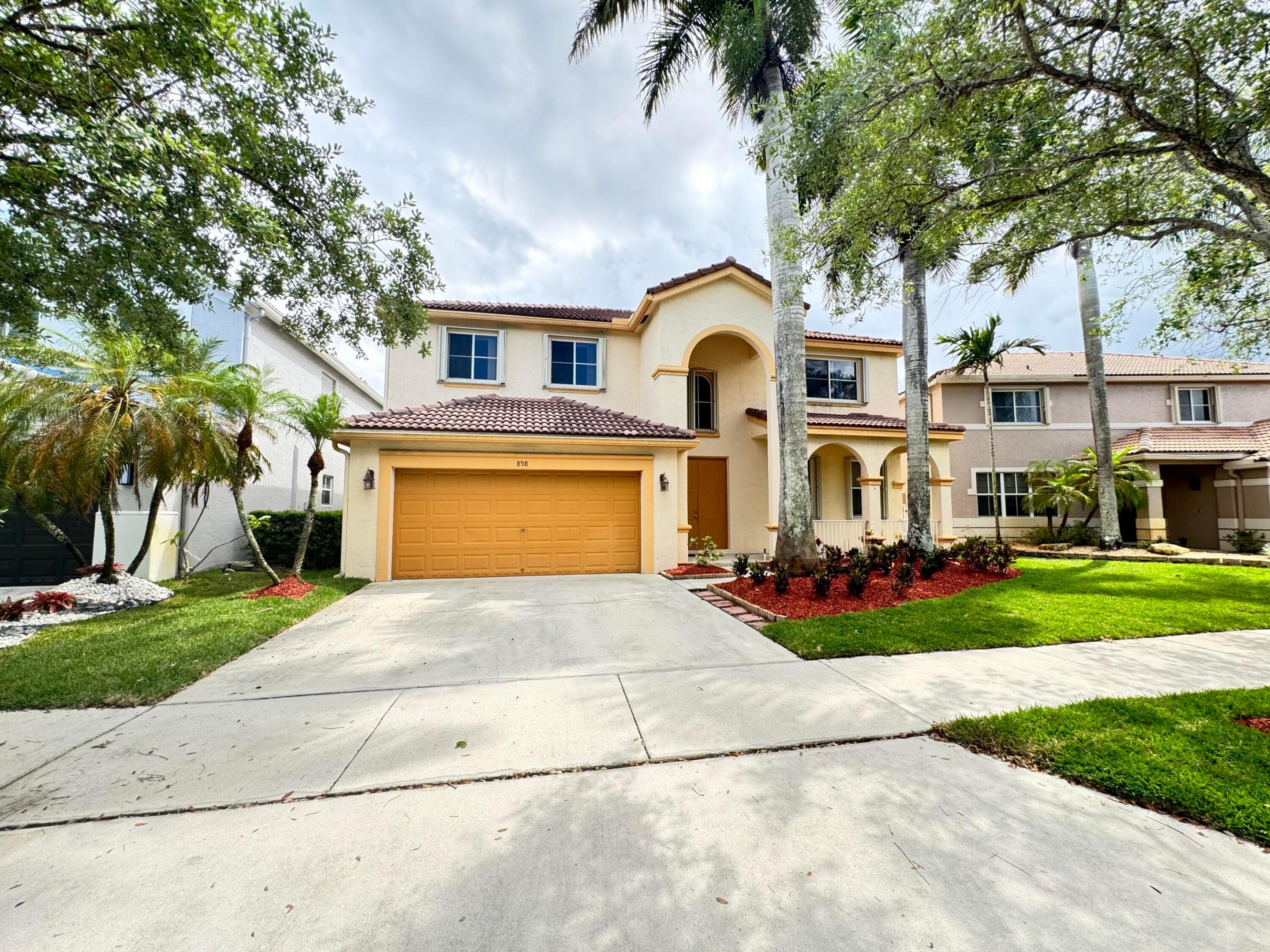 Spacious 5 bedroom, 4 bathroom home located in the desirable Savanna gated community in Weston. This freshly painted home features a neutral color palette, new vinyl flooring throughout. The first floor includes a guest bedroom and full bathroom, making it ideal for visitors, extended family, or a home office. The kitchen offers 42-inch wood cabinets and granite countertops, providing both style and functionality. The large primary suite features two closets and an en-suite bathroom. Formal living and dining areas create an elegant atmosphere, while the spacious family room opens to a screened backyard patio overlooking a beautiful lake view. Residents enjoy resort-style amenities including pools, mini-golf, basketball courts, soccer and access to top rated school.