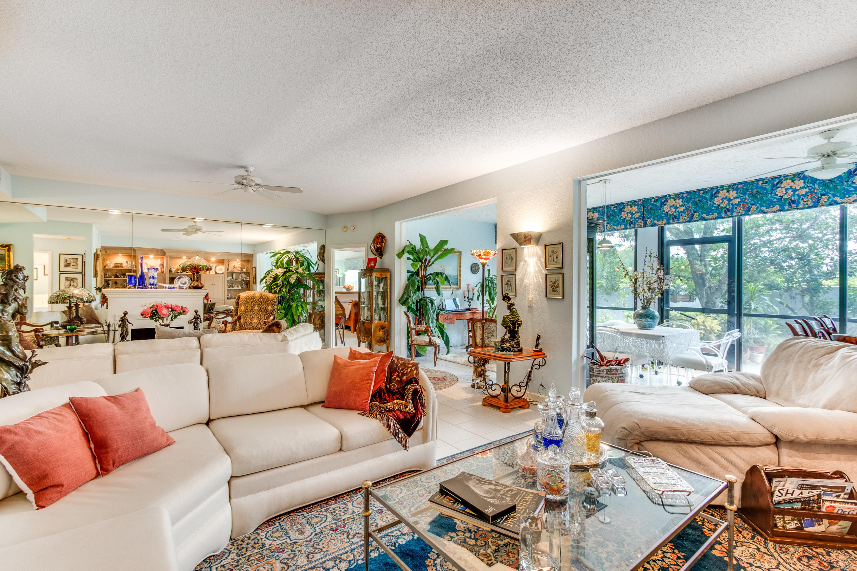 THIS VERY SPACIOUS FIRST FLOOR COACH HOME WITH A LARGE 1.5 CAR GARAGE LIVES & FEELS LIKE A SINGLE FAMILY HOME! THE FLORIDA ROOM FEATURES AN AWESOME WET BAR AND WAS OPENED UP TO GIVE AN OPEN CONCEPT FEELING & ADD LOTS OF EXTRA SQUARE FOOTAGE...GREAT FOR ENTERTAINING! THE KITCHEN FEATURES NEW STAINLESS STEEL APPLIANCES AND AN EAT-IN BREAKFAST AREA. DINING AREA FEATURES A GORGEOUS CUSTOM BUILT-IN SERVER WITH LIGHTING. FAMILY ROOM FEATURES A CUSTOM BUILT-IN ENTERTAINMENT CENTER...MASTER BEDROOM IS VERY LARGE WITH ROOM FOR A SITTING AREA AND FEATURES NEW ''WOOD LOOK'' PORCELAIN TILE. GUEST BEDROOM FEATURES BUILT-IN DESK & GREAT STORAGE! RELAX ON THE OVERSIZED OUTSIDE PATIO WITH LOTS OF OPEN GREEN SPACE FOR GARDENING & GREAT FOR GRILLING OUT! COUNTRY CLUB AVAILABLE TO JOIN...NOT MANDATORY