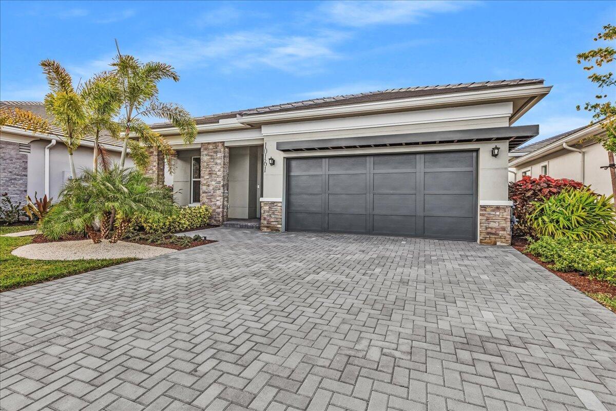 Welcome to an exceptional opportunity to live in the highly sought after Regency at Avenir, where luxury 55+ living meets immediate move-in convenience. This never lived in, lakefront Samantha model is perfectly positioned on a premium waterfront lot with fountain views, this residence delivers both tranquility and scenic beauty, with stunning sunsets right from your private fenced-in backyard. This home is complete, upgraded, and ready for immediate enjoyment. Located within the gated Regency at Avenir, residents enjoy access to world-class amenities including a luxurious clubhouse, resort-style pool, fitness center, tennis and pickleball courts and a vibrant social calendar.  All of this just minutes from the greatest of Palm Beach's shopping, dining, beaches, and highways.