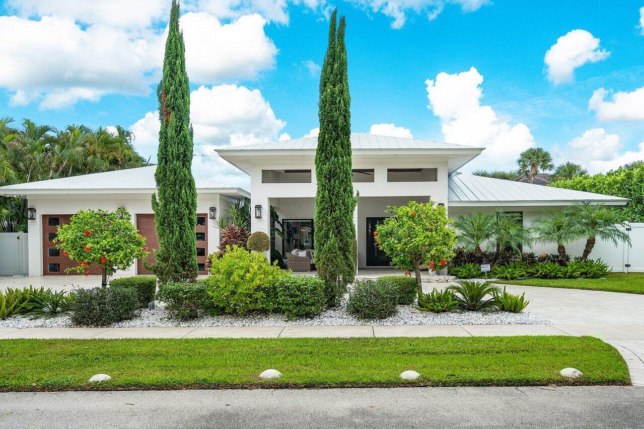 Sprawling single-story home in the desirable Lake Ida neighborhood of Delray Beach; impeccably renovated with utmost attention to every detail, showcasing beautiful stretching views of Lakeview Park and Lake Ida! A wide circular drive and 2-car garage provide ample parking for family and guests upon arrival. Resort-like living is optimized with lovely landscaped grounds and a wonderful large private fenced yard with an oversized heated saltwater pool, spa and sun shelf for outdoor enjoyment. Walls of glass invite generous natural light into the home and create a seamless indoor-outdoor experience for living and entertaining. Originally designed and built in 1953 by prominent Delray architect Sam Ogren, Jr., this 5 bedroom 3.1 bath gem was completely gutted and rebuilt, like new in 2018. This gorgeous home was literally redone from top to bottom with 400 tons of cement poured for the new foundation, walls and leveling of the floors. The list of refinements are far too many to list. All new electric was installed with safe and durable underground power lines, high-end programmable switches, dimmable recessed lighting, a 6-camera monitoring system, the list goes on. A direct gas line was also run to efficiently power the washer/dryer, tank-less water heater, Wolf stove, spa heater, and whole-house generator that provides backup power should an outage occur. A Doorbird entry system with front door camera and remote unlocking, smart features like wall-mounted iPads to control various systems and pool equipment, a remote-operated gas fireplace in the living area, 3-zone AC with Nest programmable thermostats and more make this home extremely comfortable and state-of-the-art. On to the more glamorous upgrades, beautiful Brazilian Pecan engineered wood floors spill throughout, enriching the ambience of the expansive open-concept layout. The chef's kitchen is a custom work of art with sleek cabinetry, decorative tile backsplash, an enormous prep, storage and dining island, and premium Wolf and Sub-Zero appliances with an 18" wine fridge. The luxurious master bath is graced by top-of-the-line appointments with a dual-head rain shower and steam mist operator with a scented oil reservoir for a spa experience. For the car lover, the two car garage is customized for to allow for lifts in the future to accommodate 4 cars. The location is superior, near blissful sandy beaches and vibrant downtown Atlantic Avenue. A convenient park across the street has walking trails, a boat launch and children's playground. 

*Home is currently rented and may be difficult to show.*

The information published and provided including but not limited to prices, measurements, square footages, lot sizes, features, finishes, and calculations are subject to errors, omissions or changes without notice.  All such information should be independently verified.  All parties should perform their own due diligence to verify all information.