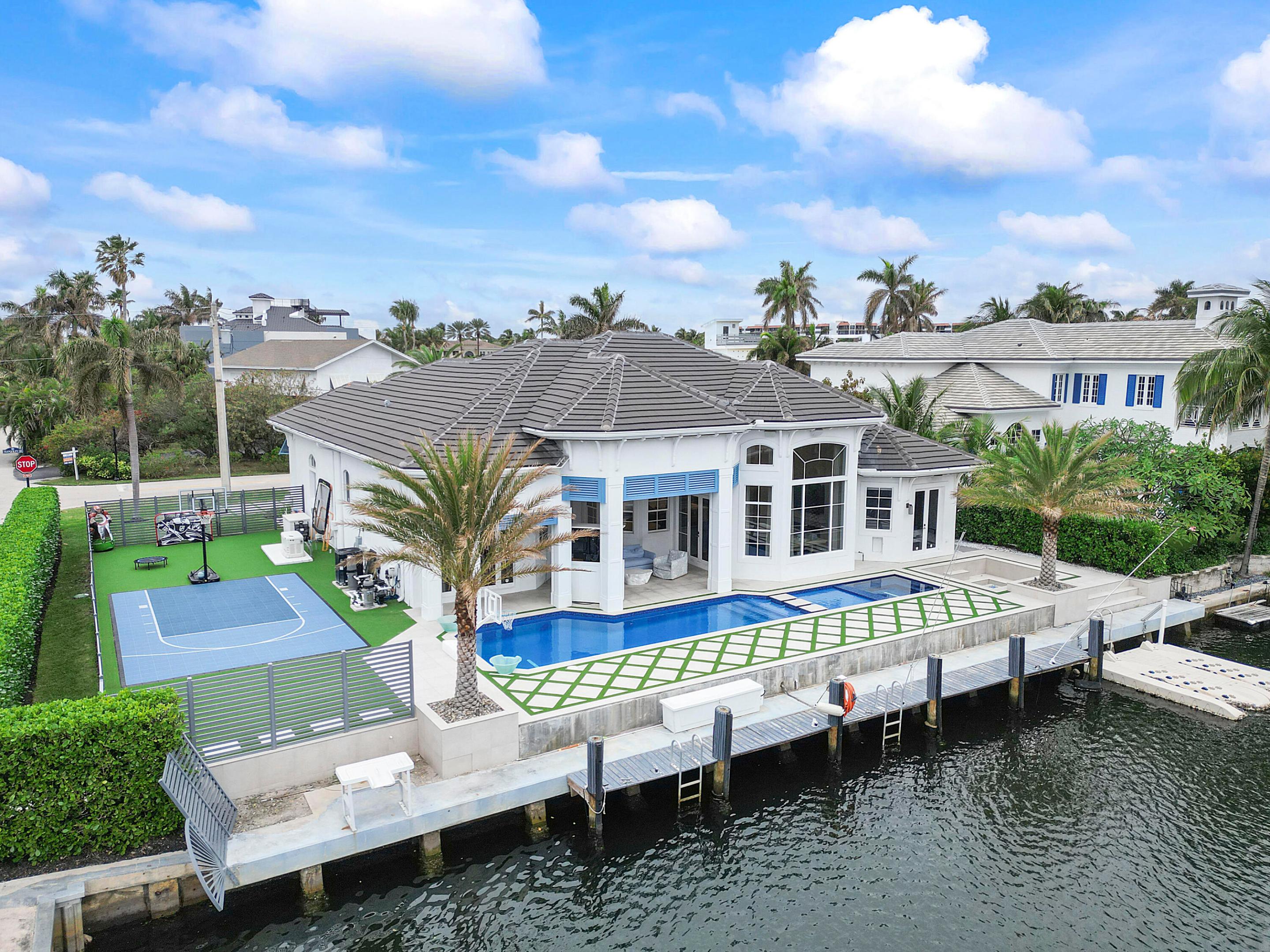 CUSTOM DESIGNER BEACH HOUSE! This unique, finely detailed and elegant home boasts entry doors made of Alder wood, white washed French oak floors, floor to ceiling carpentry and 500 gallon aquarium center piece. Italian tile & doors throughout with drapery, colors and crafted fixtures handpicked just for this home. High impact windows, roof 2019, 3 car garage, Meile appliances and NO EXPENSE SPARED w/ fully equipped control4 AUTOMATION SYSTEM including retracting patio screens. Master quarters include 12ft closet cabinetry, steam shower w/ built-in tv and stunning Italian handmade Swarovski crystal tiles. Home theater with fitted and imported Rolls Royce recliners. 100ft of water frontage w/ ocean access, in ground firepit, basketball court, SW heated pool w sun shelf & hot tub! Slow walker? No sweat, you'll still get to the Bel Lido private beach in less than five minutes. Perfectly located between both Delray and Boca's downtown cores and vibrant public beaches! Private airport BCT 10 min away. Fly out of PBI, FLL and/or MIA (30min-1hr drive) Private schools and A rated public schools nearby. Come live your best life in Highland Beach!