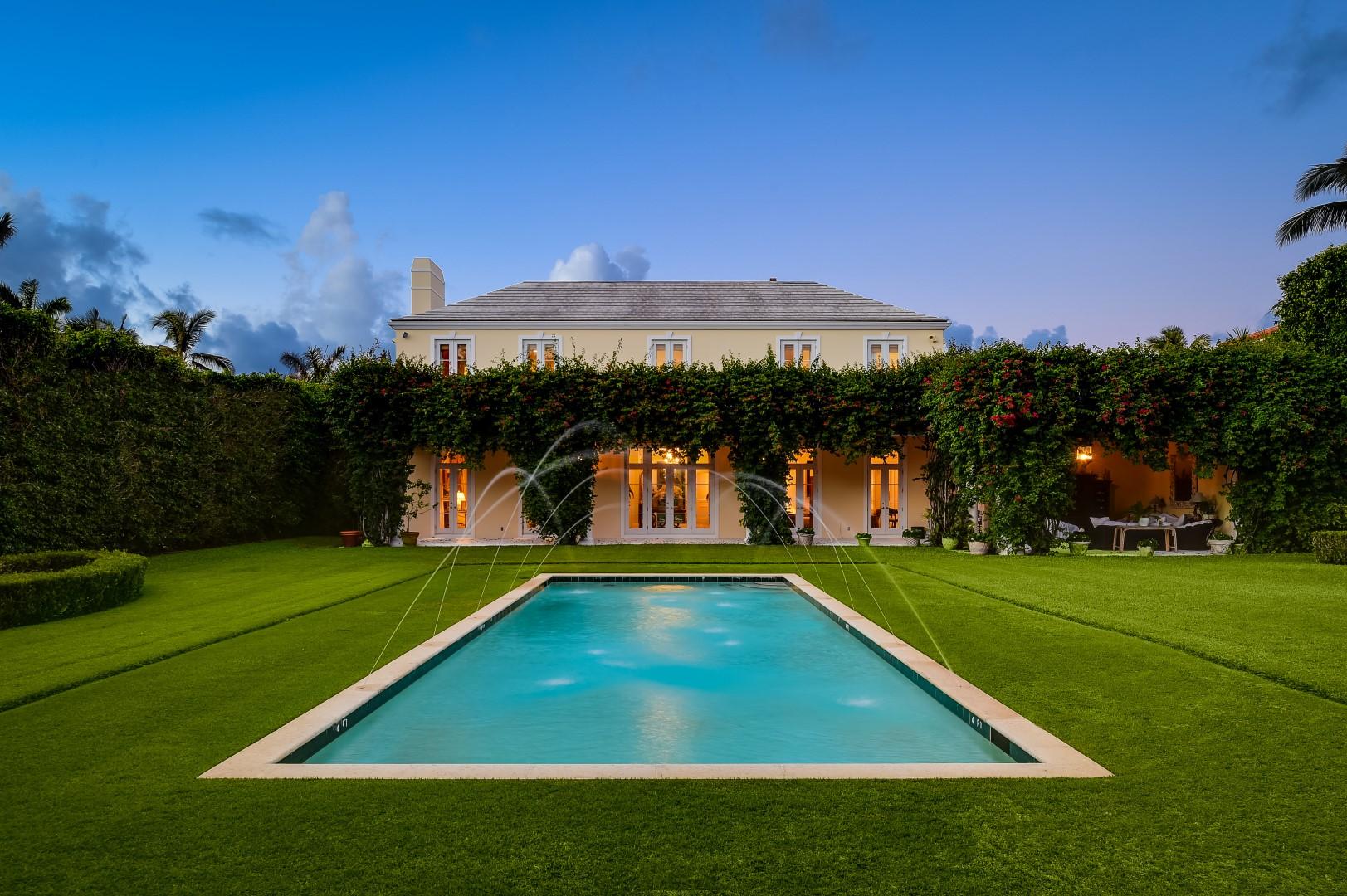Beautiful 6BR/6.3BA Neoclassical estate on premier 125’ by 255’ +/- lot. Built in 2000, this elegant home offers a spacious layout with expansive living and family rooms, high ceilings, paneled library with fireplace, and elevator. Extensive second floor master suite with sitting room, balcony, and dual baths. Gorgeous columned loggia overlooking backyard and pool.