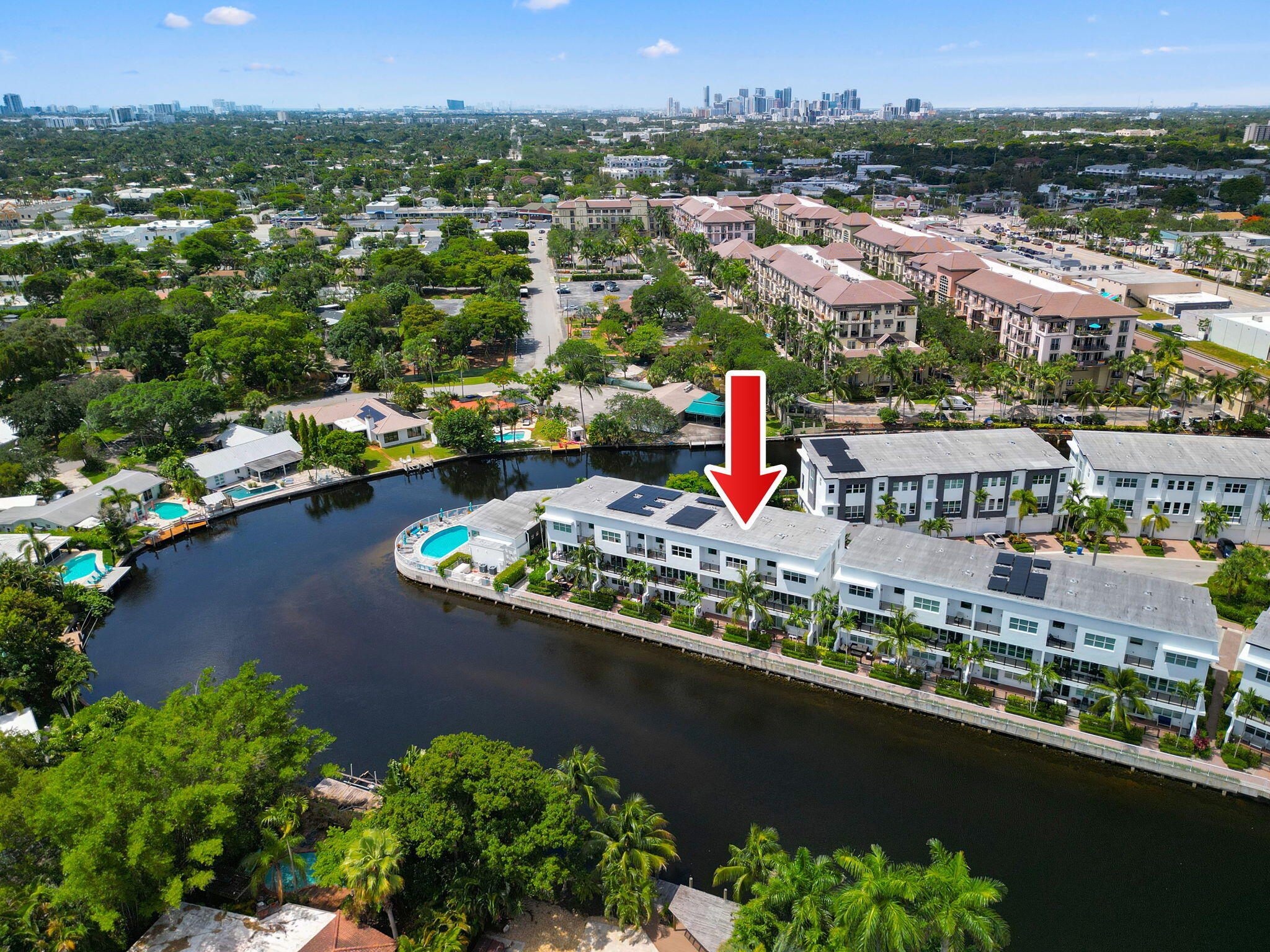 When privacy and water views matter - welcome to unit 25 at The Pointe at Middle River! 1 of only 5 units out of 40 with total private views on both sides. High ceilings make this bright & airy interior unit feel massive. Located directly across from 3 guest spots with an epoxied 2-car garage. Features cost-saving gas (stove, dryer, water heater). LIVE, WORK, PLAY LAYOUT: L1 features a huge 19'x13' bonus room/office, half bath & river patio for gas grilling. L2 boasts glossy porcelain tile, open great room, island chef's kitchen, half bath & river-view deck overlooking Wilton Manors. L3 holds the owner's suite with private balcony, 2 guest beds, full bath & laundry. Gated community with resort pool, gym, clubhouse. Minutes to Wilton Dr, Whole Foods, Trader Joe's, I-95 & beaches!