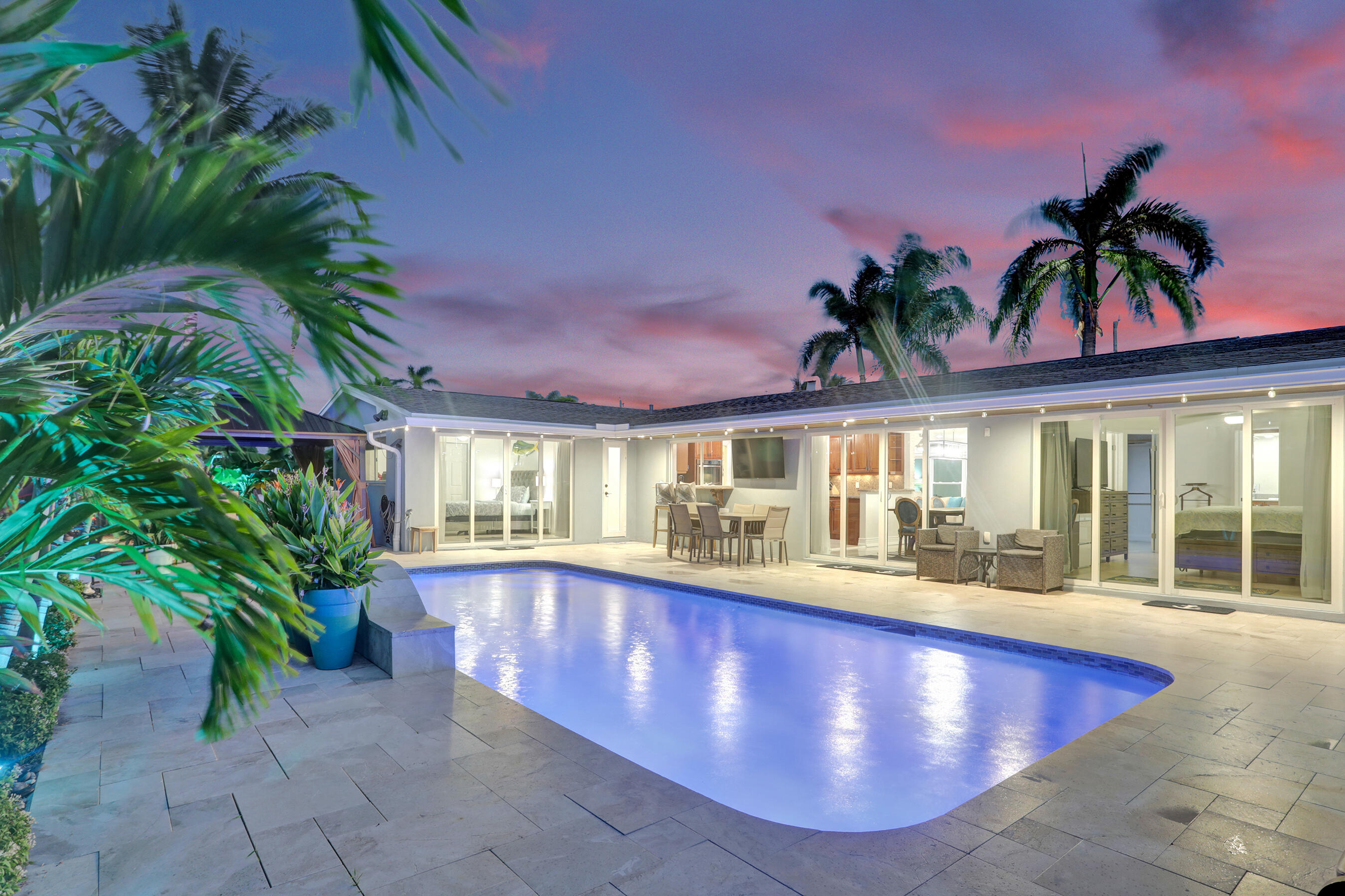 Rare 4BR/3BA waterfront pool home with direct ocean access on a quiet dead-end street. Offering over 2,000 sqft, this is one of the largest original floor plans in the neighborhood with no additions or conversions. Heated pool and patio renovated in 2023. Oversized impact sliding doors and windows provide abundant natural light, water views from nearly every room. Features include a 2021 roof, A/C, two tankless water heaters, new attic insulation (2024), landscape lighting, tropical banana and coconut trees, and a chef's kitchen with double ovens, induction cooktop, ample storage, all impact windows & doors. Two ensuite bedrooms, large closets, STR potential, furniture negotiable, and close to I-95, beaches, and airport.