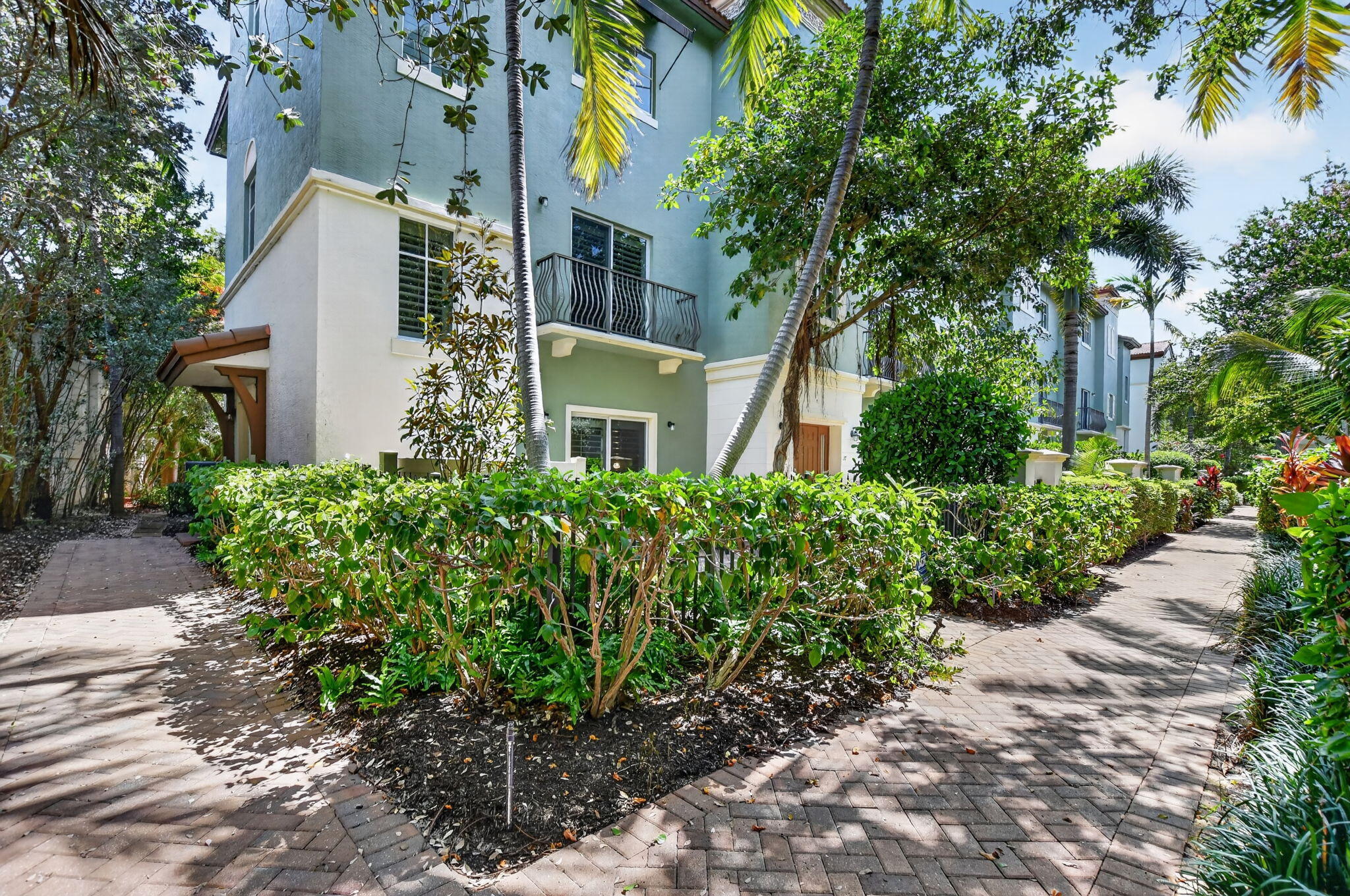 Rarely Available! Experience the best of East Boca living in this beautifully designed three-story townhome in the sought-after Library Commons community, just moments from Mizner Park, downtown Boca Raton, the Brightline station, and the area's world-renowned beaches. Offering over 2,150 square feet of living space, this residence features three spacious bedrooms, 3.5 bathrooms, a private elevator servicing all three levels, and an attached two-car garage.  The thoughtfully designed floor plan provides exceptional flexibility, with generous living spaces ideal for both everyday living and entertaining. Each bedroom offers privacy and comfort, while the multiple levels create the perfect balance of shared and personal space.