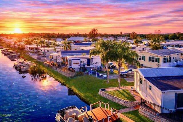 Enjoy winter escapes or full-time retirement at Big O RV Resort. This peaceful waterfront lot is the perfect setting for your RV or park model, offering serene views and a relaxed lifestyle. Located in an active, gated 55+ community, residents enjoy planned activities, on-site management, and an impressive array of amenities, including a heated pool, putting green, shuffleboard, laundry facilities, recreation hall with large screened TV, pool table, basketball court, and a community boat ramp with access to the Rim Canal and Lake Okeechobee. Conveniently located just minutes from shopping, dining, golf courses, and the Seminole Brighton Bay Hotel and Casino. The adjoining lot is also available for purchase.