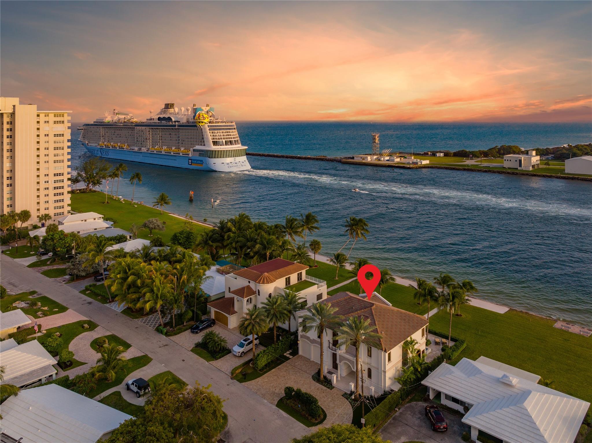 Captivating panoramic vistas greet you upon entering this exceptional estate, gracefully perched on the Port Everglades Ship Channel. The sweeping views, framed by expansive walls of glass, stretch from the ocean, encompassing the Intracoastal Waterway and the bustling port. You'll be treated to an endless spectacle of luxury yachts, cruise ships, sailboats, naval vessels, marine wildlife. This custom-built masterpiece, boasting opulence at every turn, is now available for immediate occupancy. The property features generously sized bedrooms and bathrooms, imported porcelain floors, gym & a newly updated chef's kitchen complete this lavish offering. Enjoy deeded beach rights and access to the pristine shoreline right from your backyard. Unwind in the expansive heated pool at the clubhouse.