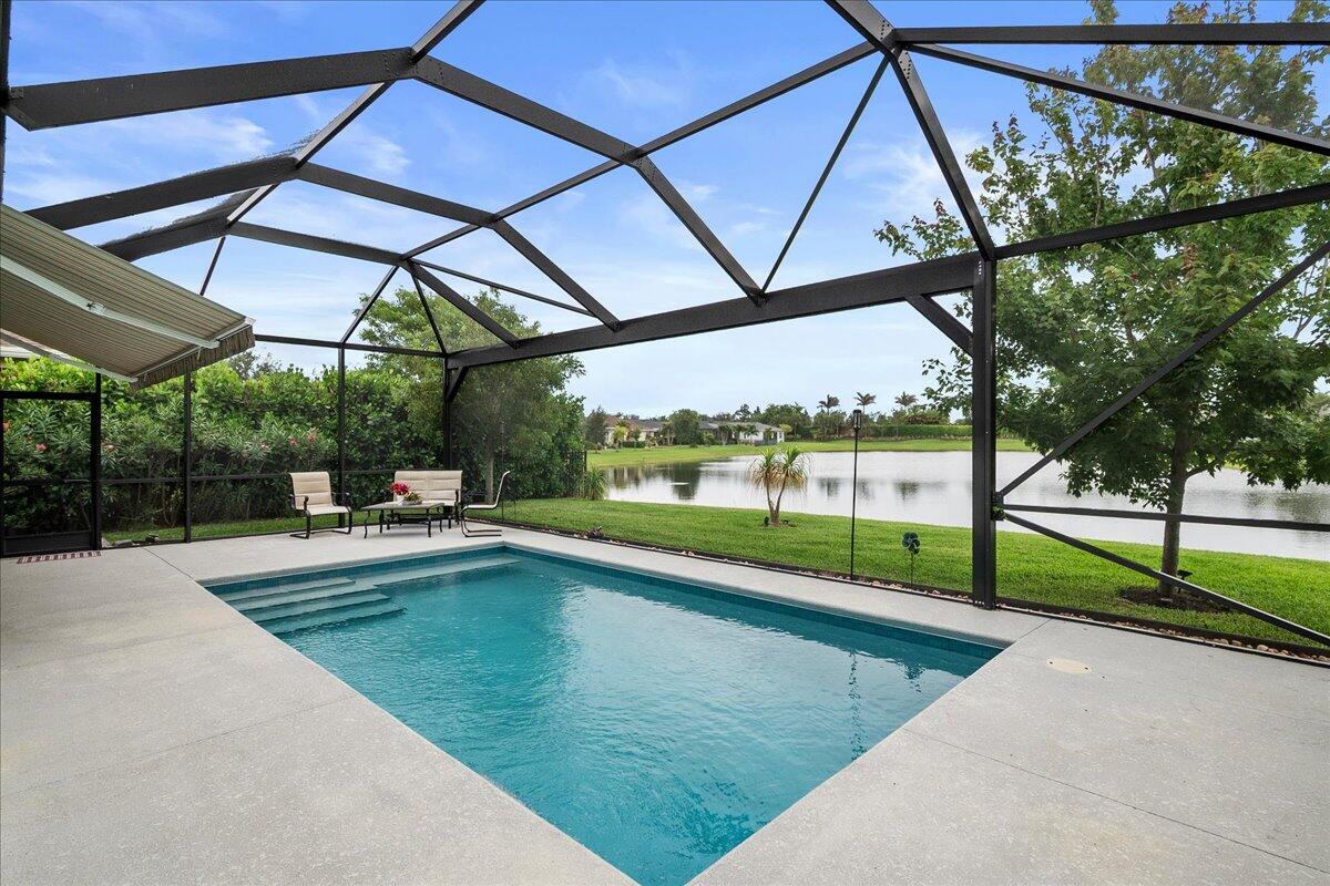 Lakefront Sofia model in the highly sought Veranda Preserve 55+ gated community offering 3 bedrooms + den, 3 full baths, and 2,032 sq ft of beautifully upgraded living space. Built for comfort, security, and effortless Florida living, this home features impact glass windows, doors, and garage door, a whole-house 18K generator, gas range and gas water heater, and a heated saltwater pool overlooking the lake. The screened lanai with awning and Storm Smart hurricane shutters creates a true indoor-outdoor retreat you can enjoy year-round. Inside, you'll find 18" ceramic tile throughout (no carpet), quartz countertops, GE stainless steel appliances, plantation shutters, and a fully WiFi-certified smart home system with Rukus access points. Every detail has been thoughtfully designed  so you can move in and start enjoying it immediately. Beyond the home, Veranda Preserve delivers a resort-style lifestyle with a clubhouse, sparkling pool, fitness center, tennis, pickleball, and bocce courts, plus an active social calendar. Located in a quieter part of Port St. Lucie with lower HOA fees, this is lakefront living with peace of mind, modern upgrades, and everyday resort comfort all in one.
