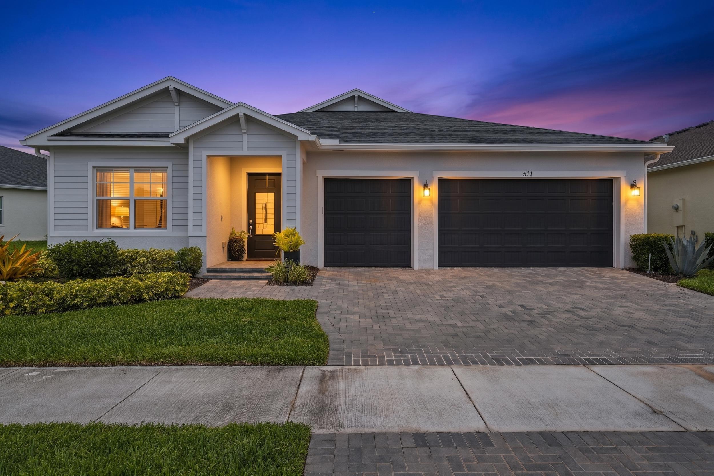 Built in 2021, this single-story Lennar Treviso offers a bright, open floor plan with 2,581 square feet of tile and wood-look flooring, tray ceilings, and crown molding throughout the main living areas. The kitchen anchors the great room with an oversized quartz island with seating, white cabinetry to the ceiling, a gray subway backsplash, a natural gas range, stainless appliances, and a walk-in pantry. A formal dining room sits just off the entry foyer. A split layout gives the primary suite its own side of the home, with a large walk-in closet, a dual-sink vanity, and a frameless glass walk-in shower with a built-in bench. Two more bedrooms, three full baths, an interior laundry room, and a three-car garage complete the floor plan. A covered lanai overlooks a fully fenced backyard.  The home sits in Veranda Preserve West, an active adult 55 and over community with a resort clubhouse, heated pool, pickleball, tennis, and bocce courts.