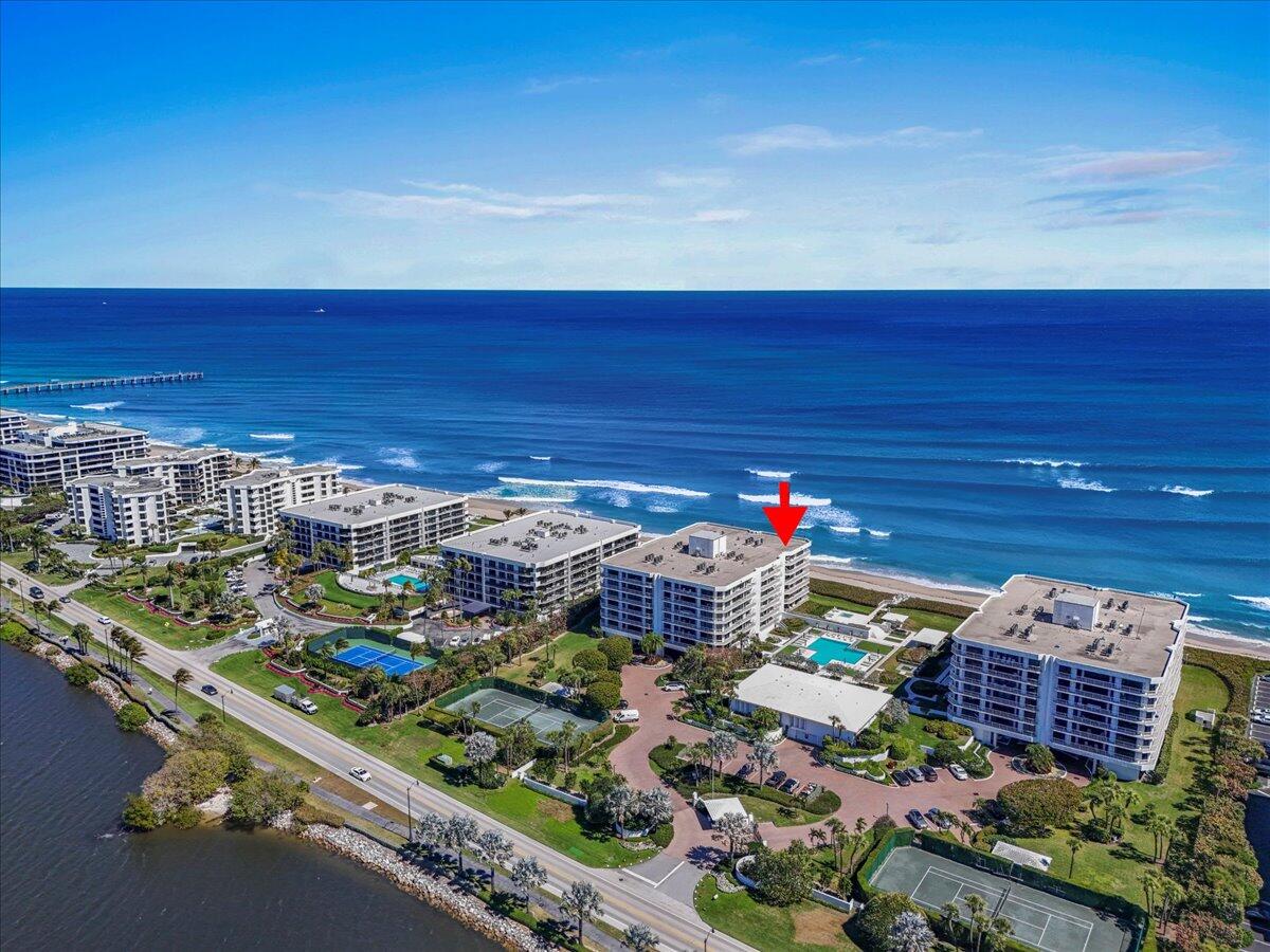An exceptional opportunity for premier oceanfront living in Palm Beach. From the moment you enter this stunning 5th-floor residence, you are greeted by spectacular, unobstructed ocean views. This beautifully appointed 3-bedroom, 3-bath condominium offers 3,577 total square feet of refined and comfortable living space. A full wraparound balcony showcases sweeping panoramic vistas of the Atlantic Ocean, the wide Intracoastal Waterway, and the resort-style infinity pool and sundeck below. Ideally positioned within the prestigious Enclave of Palm Beach, this remarkable residence has never before been offered and enjoys the most coveted location at the Enclave —direct oceanfront, southeast corner of the north building—providing a serene sunrise-to-sunset setting.  A gracious foyer opens to... an expansive great room filled with natural light. Floor-to ceiling impact glass doors span the residence, enhancing the bright, airy ambiance. Every room features direct access to the wraparound balcony, creating a seamless indoor-outdoor lifestyle. Panoramic views of lush, landscaped grounds extending to the Atlantic Ocean provide an exceptional Palm Beach backdrop. Two garage parking spaces and additional storage are included.  The Enclave offers an elevated standard of living with beautifully curated interiors and an array of resort-style amenities. Recently renovated designer lobbies and hallways complement a stunning infinity-edge pool, sundeck, and enhanced landscaping from renowned architect Mario Nievera. Residents also enjoy a state-of-the-art fitness center, two Har-Tru tennis courts, a 2BDR guest suite, and 24-hour manned gatehouse and doorman services. Updated structural integrity reports and strong financial reserves provide added confidence and peace of mind.  Experience the perfect balance of elegance, privacy, and world-class amenities - where luxury living meets the vibrant Pal Beach lifestyle.