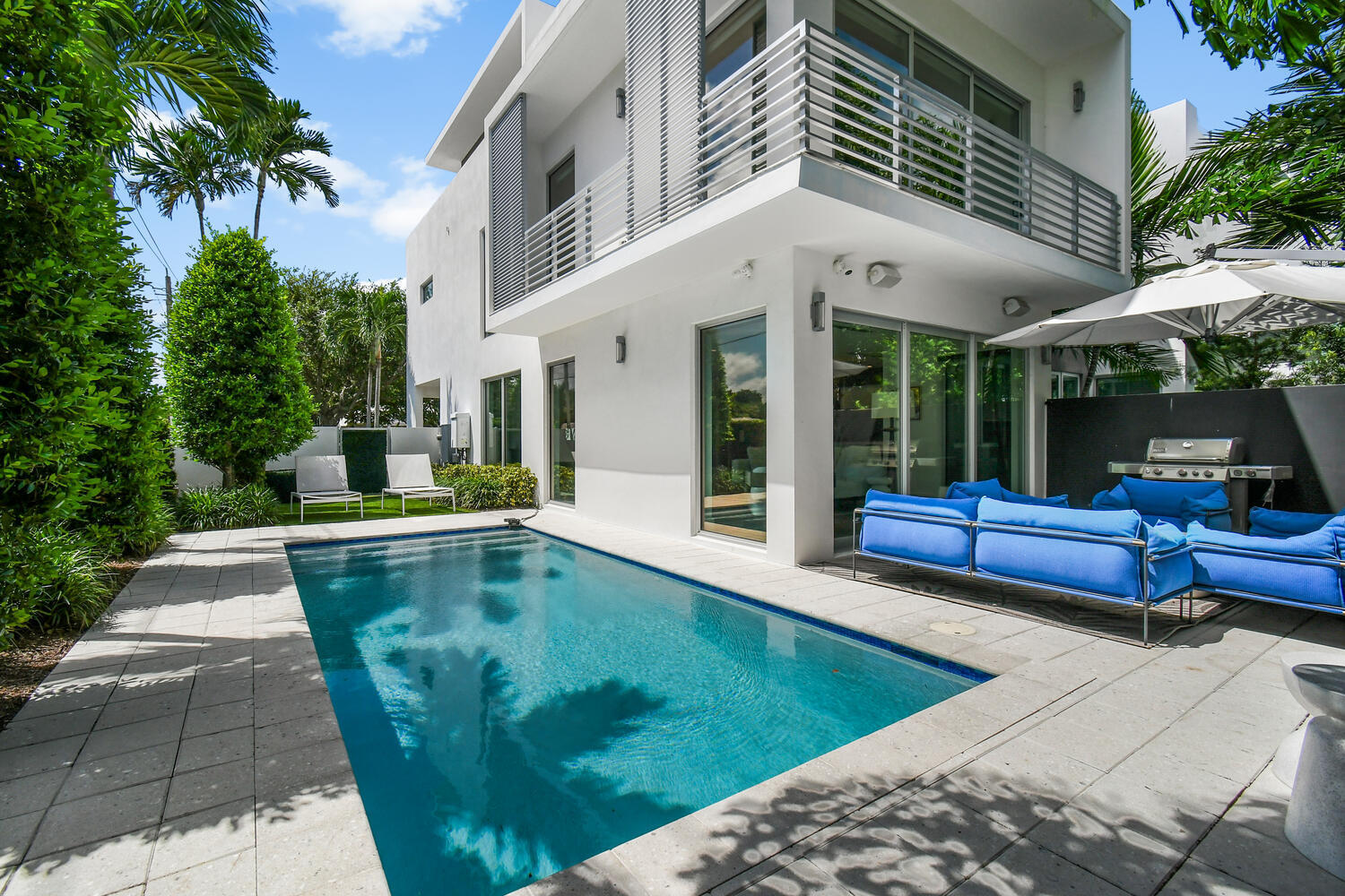 Steps from the ocean in Delray Beach's most desirable neighborhood sits this exquisitely built, corner-unit townhome. With floor-to-ceiling hurricane impact windows, private backyard & oversized private pool, this lives like a Single Family Home. No detail has been overlooked, nor has a single expense been spared to provide the owner with an unparalleled lifestyle. The open-concept main floor boasts a custom kitchen overlooking the private backyard, along with Miele (gas) appliances, custom commissioned backsplash & quartz countertops. A 2nd-floor primary suite features a private wrap-around balcony, custom-built closet, floor-to-ceiling windows & more custom artwork in the ensuite bathroom. All 3 bedrooms have their own private terrace, ensuite bathroom & customized walk-in closets. The top floor is the crown jewel of this property with more floor-to-ceiling windows leading to a 650sqft rooftop terrace offering views of the Intracoastal. Truly a "lock & go" property, this smart home can be controlled from your phone. Smart features include smart locks & security system, hard-wired automated Hunter Douglas blinds, video cameras, dedicated AC on each floor with smart thermostats, automated lighting & more! The HOA fee covers exterior insurance, pool care & all landscaping. Perfect for full-time or seasonal use, this exceptional property in Delray Beach's most sought-after neighborhood is sure to impress. Call today for a private showing. This incredibly rare property will not last long!