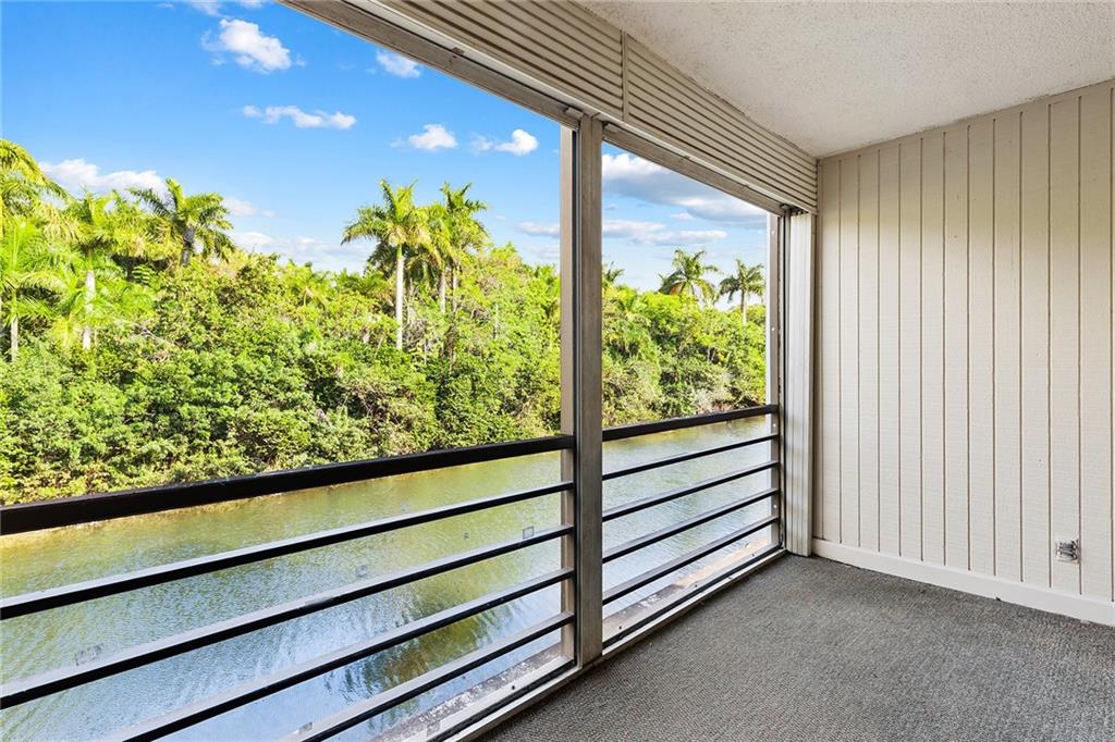 Best location in complex on the water with a green/peaceful view of Easterlin Park. Enjoy early morning sunrises from your private screened patio. Updated bathrooms and kitchen includes granite  tops and backsplash. Brand new luxury wood-like vinyl flooring. Each bedroom has its own full bathroom. Close parking space! 3 pools ,his/her gyms, community room, water and  trash included in maint. fee. This guard gated community is centrally located in Broward County-just a few minutes drive to the beaches,Las Olas, Wilton Manors,  I95 and turnpike access. Community waterfront park just outside the complex!