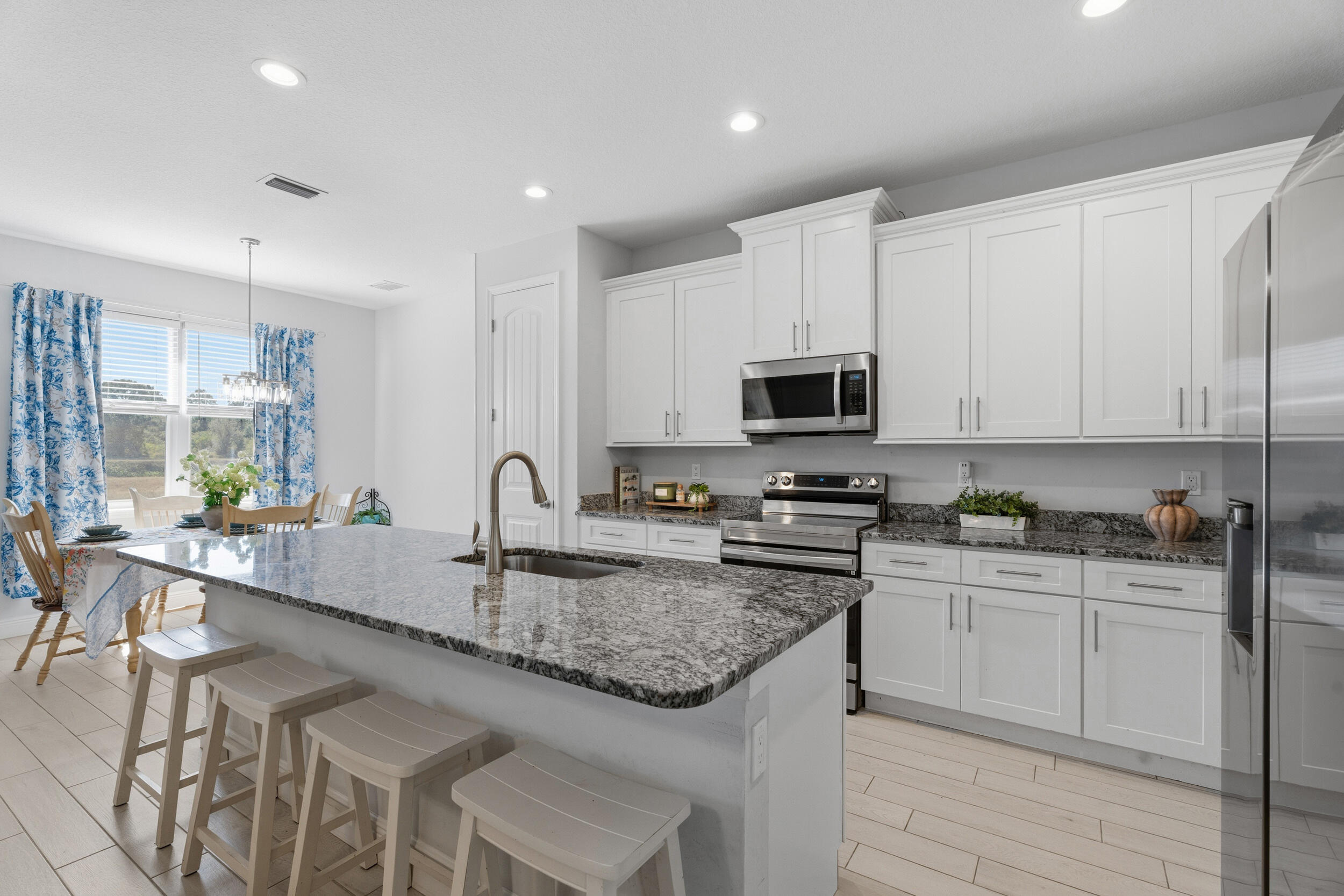 Built in 2022, this move-in ready 3-bedroom, 2-bath home with a dedicated office/den offers modern construction, peace of mind, and one of the most underrated features in Port St. Lucie — canal frontage without the premium price tag.  Set on a quiet canal with room for a future dock, this home delivers both privacy and long-term potential. Whether you're enjoying the view now or planning ahead, this is a rare opportunity to own a newer waterfront-style property in a growing area.  Inside, the open-concept layout is bright, clean, and functional, designed for both everyday living and easy entertaining. The kitchen features modern cabinetry, ample storage, and a seamless flow into the main living space. A split-bedroom floor plan provides added privacy, while the flex office can easily easily serve as a home office, guest space, or playroom.  Impact sliding door offer security, while the newer construction means energy efficiency and fewer maintenance concerns compared to older homes.  Conveniently located near shopping, dining, and major roadways, this home offers the perfect balance of quiet surroundings and accessibility.  If you've been searching for newer construction with a water view — without stretching into higher price points — this is one worth seeing in person.
