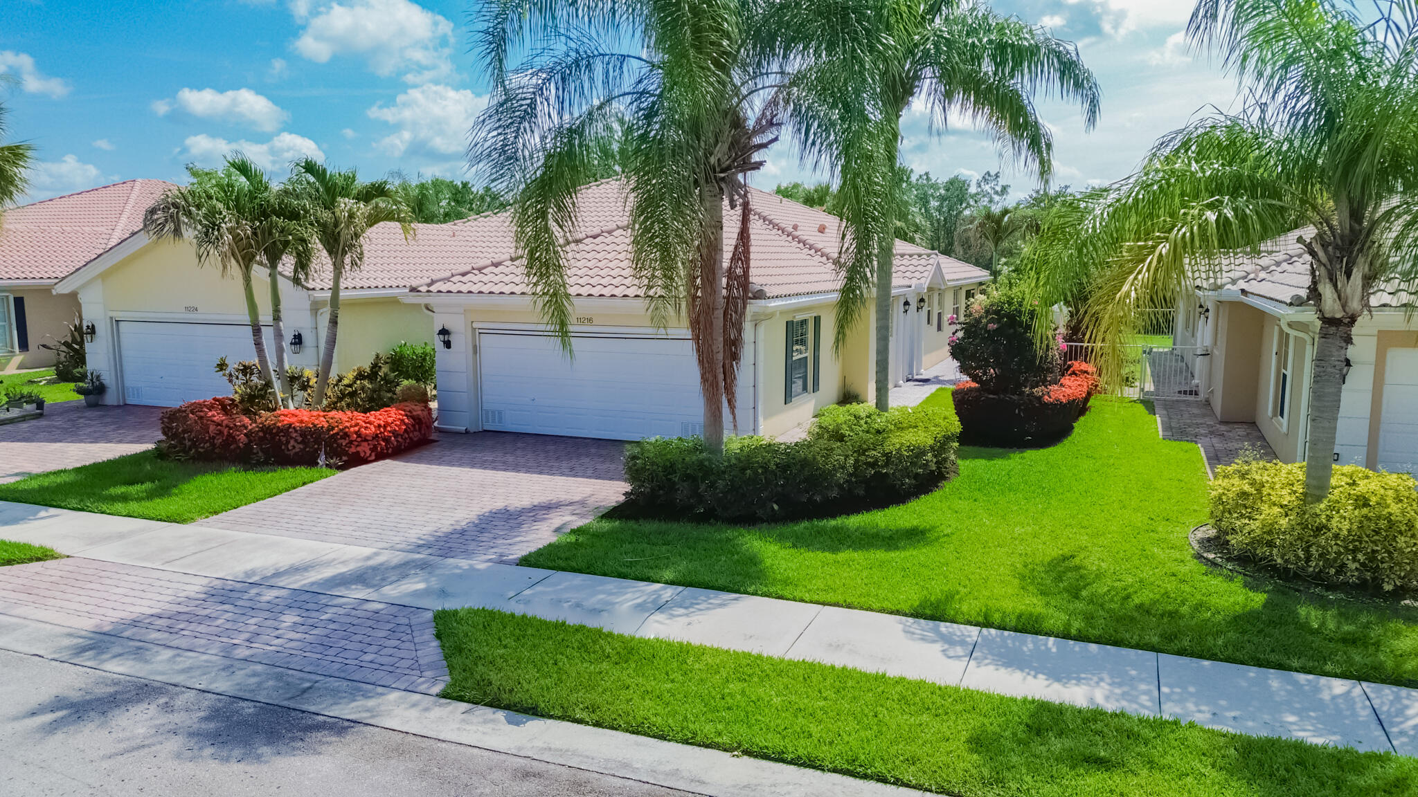 Lakes at Tradition!  Beautifully updated 2/2/2 Villa.  Interior offers tile flooring in the main areas, with new carpet in the bedrooms.  Modern kitchen with granite counters, stainless appliances, 42" custom cabinets, a pantry, and a breakfast bar open to the living/dining area.  Enjoy a private backyard with lush landscaping and a covered, screened lanai with a sun shade. The garage includes custom floors and a remote-controlled screen. HOA dues provide lawn care, cable, internet, exterior painting, pest and irrigation system maintenance.  Community amenities feature a resort-style pool and fitness center. Excellent location close to all that Tradition has to offer.   this is a must see!