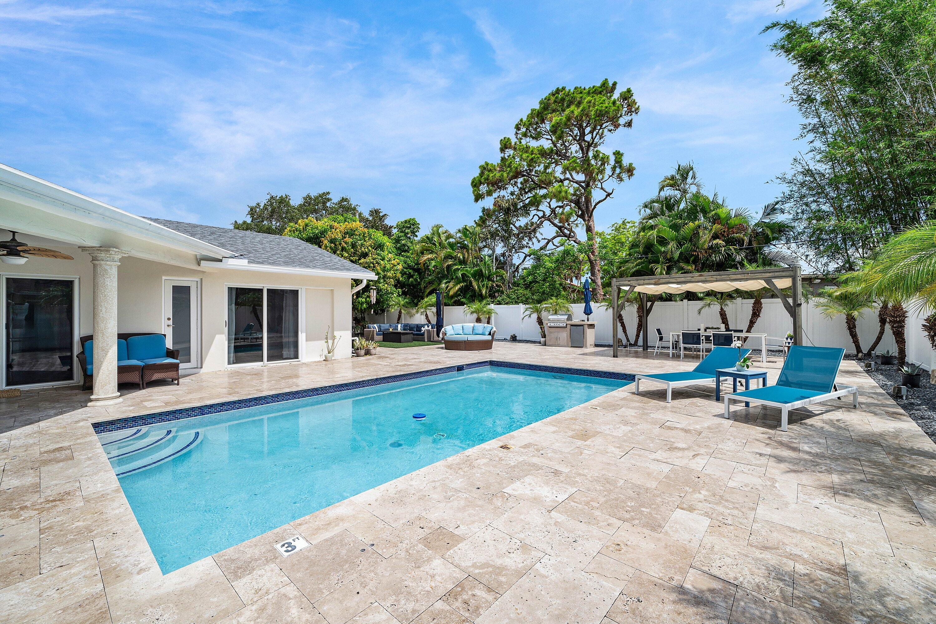 Resort-Style Coastal Contemporary 4BR/2BA pool home in highly desirable East Boca. Minutes to the beach, Downtown Boca, I-95 and Town Center Mall. Enjoy your own private tropical oasis featuring a fenced backyard with heated pool, travertine paver patio, grill station and low-maintenance turf lawn area. Perfect for entertaining or relaxing. Ideal for those working from home. Features include hurricane impact windows and sliding doors, split-bedroom floor plan, 2-car garage, and ambient lighting inside and out. Located in Boca's top-rated school district, including Addison Mizner Elementary. Experience the ultimate South Florida lifestyle in this beautifully updated home.
