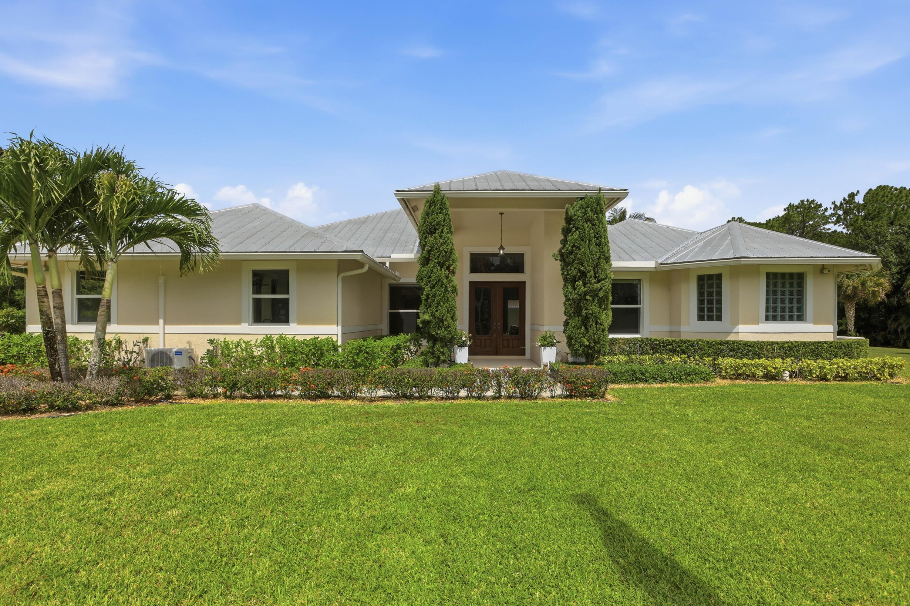 Escape to the tranquility of Jupiter Farms on this exceptional 5-acre equestrian property featuring a beautifully appointed main residence, detached guest house, and a 3-stall barn with five paddocks. Whether you're bringing horses, creating your own private retreat, or simply looking for room to spread out, this property offers endless possibilities. Enjoy the perfect balance of privacy and convenience, just minutes from Jupiter's beaches, shopping, dining, and top-rated schools.