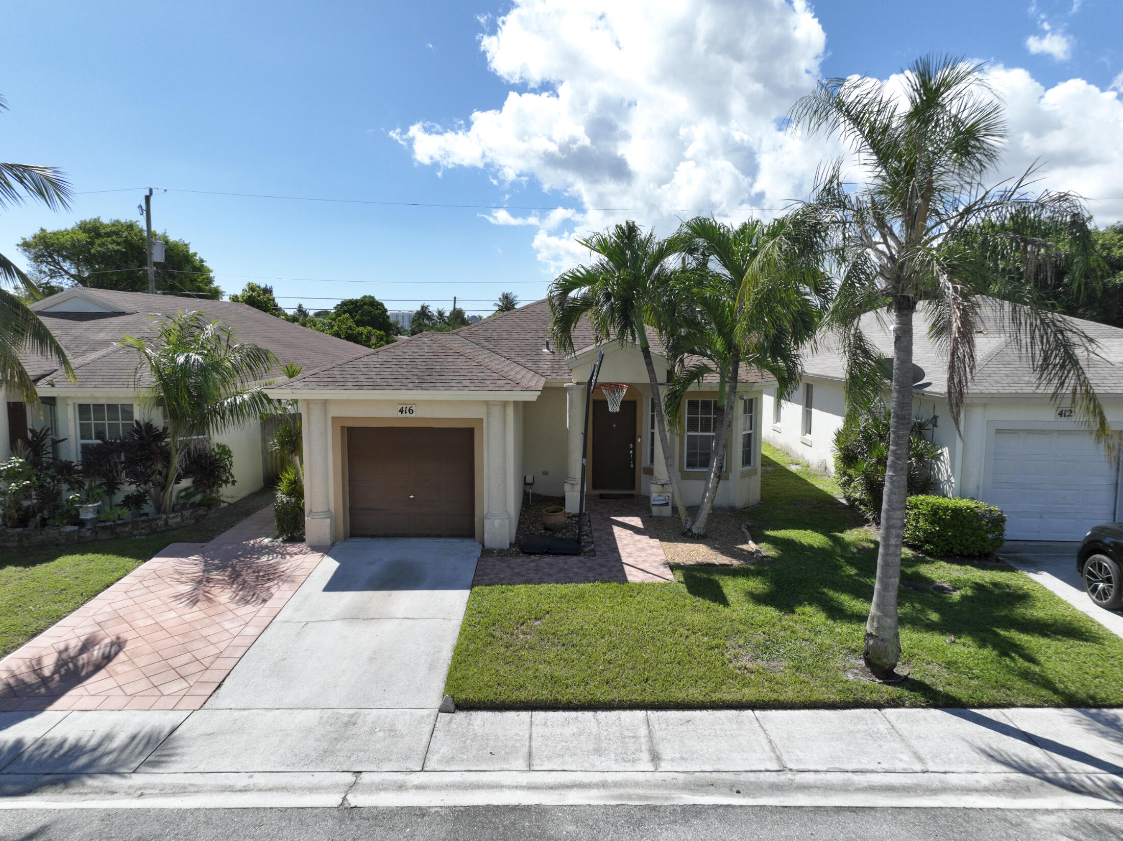 No HOA!  This coastal charm is a short walk or bike ride to sandy beaches and scenic walking trails in the vibrant community of Boynton Beach.  Nestled on a quiet, palm tree-lined street, this home offers an ideal blend of serene living with easy access to waterfront dining, parks and shopping.  The close proximity to I-95 allows for an easy commute to West Palm Beach area attractions, or a quick trip to Miami.  This Hillshire model home has privacy fencing, a generator plug, a widened/extended driveway in front of the garage that also has a side exit door.  Newer appliances, hot water heater & AC.  This could be the perfect location to run a short term rental (like AIRBNB), or to open an Assisted Living Facility, independent living facility, rehabilitation home or Adult Family Care Home!