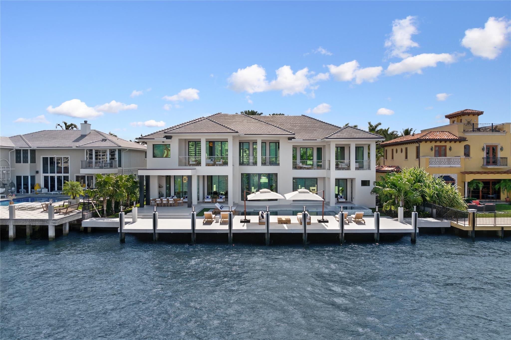 Completed in 2024 (major renovation), this luxury smart home in Seven Isles Las Olas offers wide views of 100 feet of prime waterfront. Featuring 8 beds, 7.2 baths (4 rooms currently designed as theater, gym, office with private balcony, and sitting room), state of the art gym with fitness flooring, and sitting room off the primary suite. Designed by Michael Gray, the interior boasts exotic woods, premium lighting, book-matched stones, and imported chandeliers. Custom staircase, elevator, and an authentic wine room with a marble vapor fireplace. Downsview Kitchen, full custom cabinetry, Wolf & Subzero appliance package. Expansive primary suite offers dual closets and baths. Outdoors, enjoy the large pool, spa, and summer kitchen, all with stunning views of Fort Lauderdale's Intracoastal.