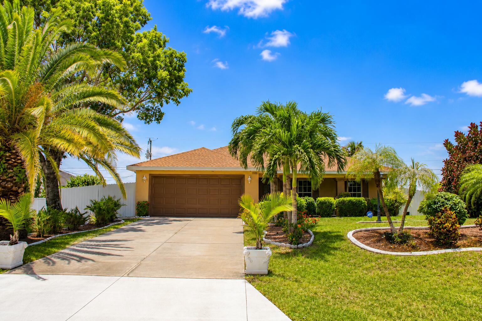 Welcome to a beautifully maintained split-floor plan home offering 3 bedrooms, 2 bathrooms, including a convenient Jack-and-Jill layout, and a spacious 2-car garage. Thoughtfully upgraded for comfort and efficiency, this home features a whole-house water filtration system, a new water heater, and solar panels designed to help reduce energy costs while providing long-term savings and added value. To make ownership even more attractive, the seller will contribute $5,000 toward the solar loan, helping lower the current monthly payment of approximately $216.  Step out to fully enclosed patio and your own tropical retreat, where mature mango, avocado, banana, and more create a lush backyard oasis perfect for relaxing or entertaining. As an added bonus, all furniture are incl. to your liking.
