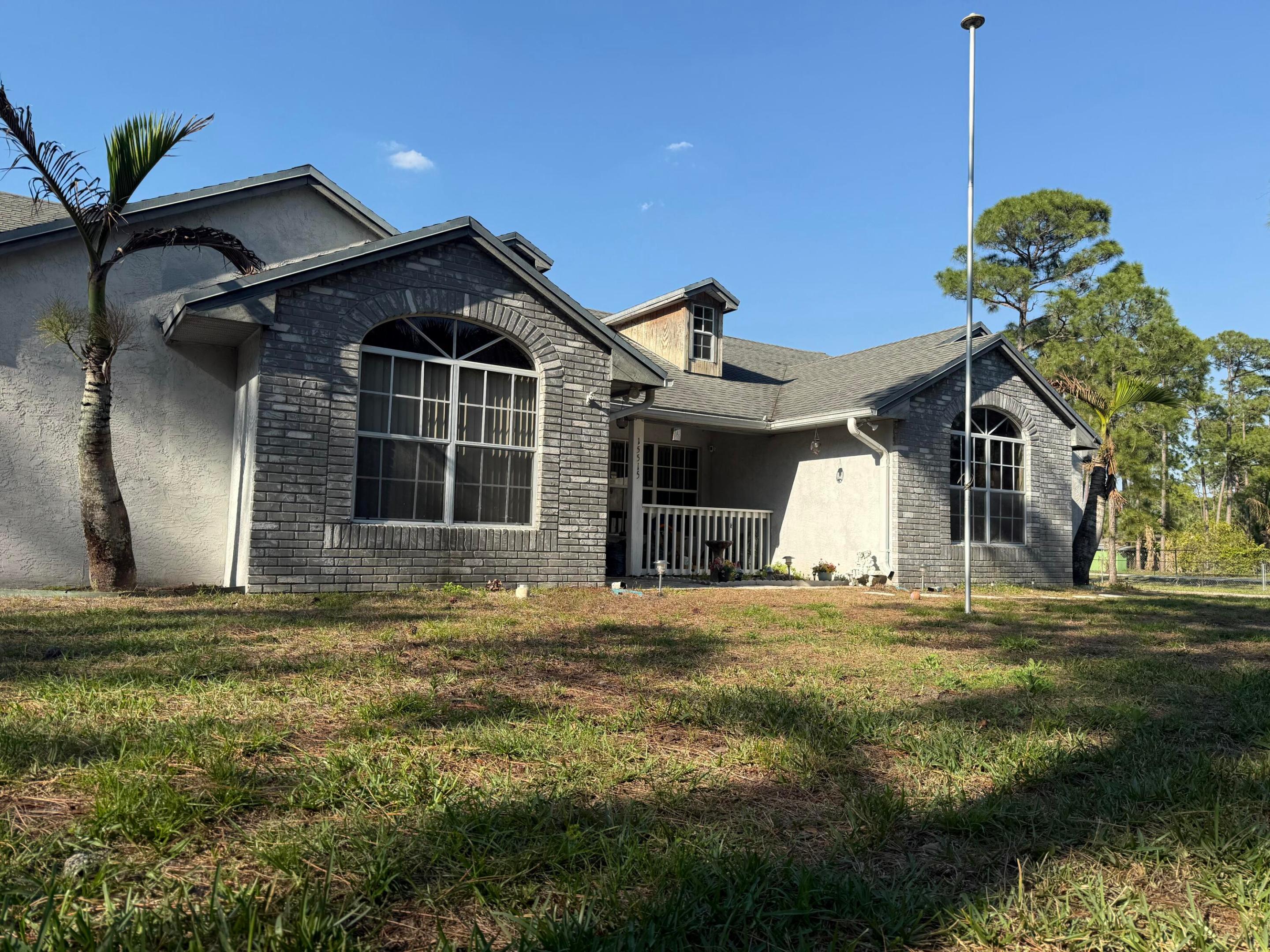 Welcome to this thoughtfully designed 4-bedroom, 2-bathroom single-family residence offering 1,833 square feet of well-appointed living space in The Acreage, FL. This one-story home provides comfortable everyday living with practical room configurations ideal for those seeking functional design. The two-car garage offers convenient vehicle storage and protection, while the open floor plan maximizes usable space throughout the residence. Whether you're looking for a straightforward property that meets your essential housing needs or seeking room to make your own design choices, this home presents an excellent opportunity in an established community.