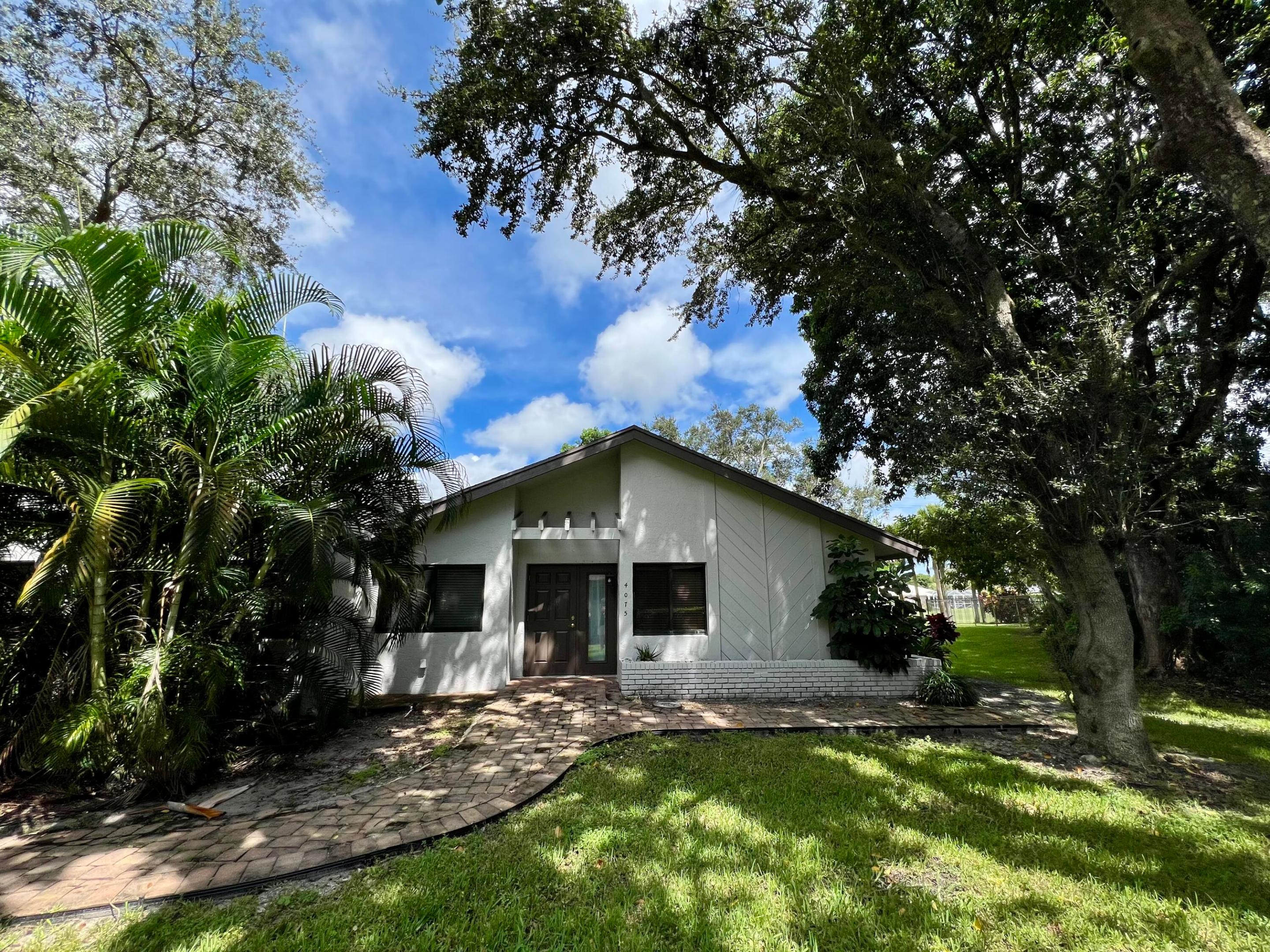 This home is also listed for rent! Welcome to your new sanctuary in the heart of Delray This Beach! This charming 2-bedroom, 2-bathroom townhome is more than just a home—it's a lifestyle. Step inside to discover a spacious primary bedroom featuring a walk-in closet and dual sinks, a newer AC, stainless appliances, the screened-in Florida room—perfect for morning coffee or evening relaxation. The home also boasts Impact Windows throughout for peace of mind. Tucked away on a corner lot, you'll love the added privacy and serene backyard views. Golf lovers, take note: it's located in the Lakeview Golf Club community, just steps from the clubhouse. Residents of Shadywoods enjoy fantastic amenities including a clubhouse, tennis and basketball courts, and a screened-in sparkling community pool.  Plus, you're less than 10 minutes from vibrant Atlantic Avenue, close to the beach, and surrounded by every convenience—Publix, Trader Joe's, Whole Foods, Fresh Market, Aldi, Starbucks, and more. Best of all, this beautiful, quiet, and safe community is just minutes from everything Delray and Boca have to offer. Pets are welcome, too! Come feel the difference.