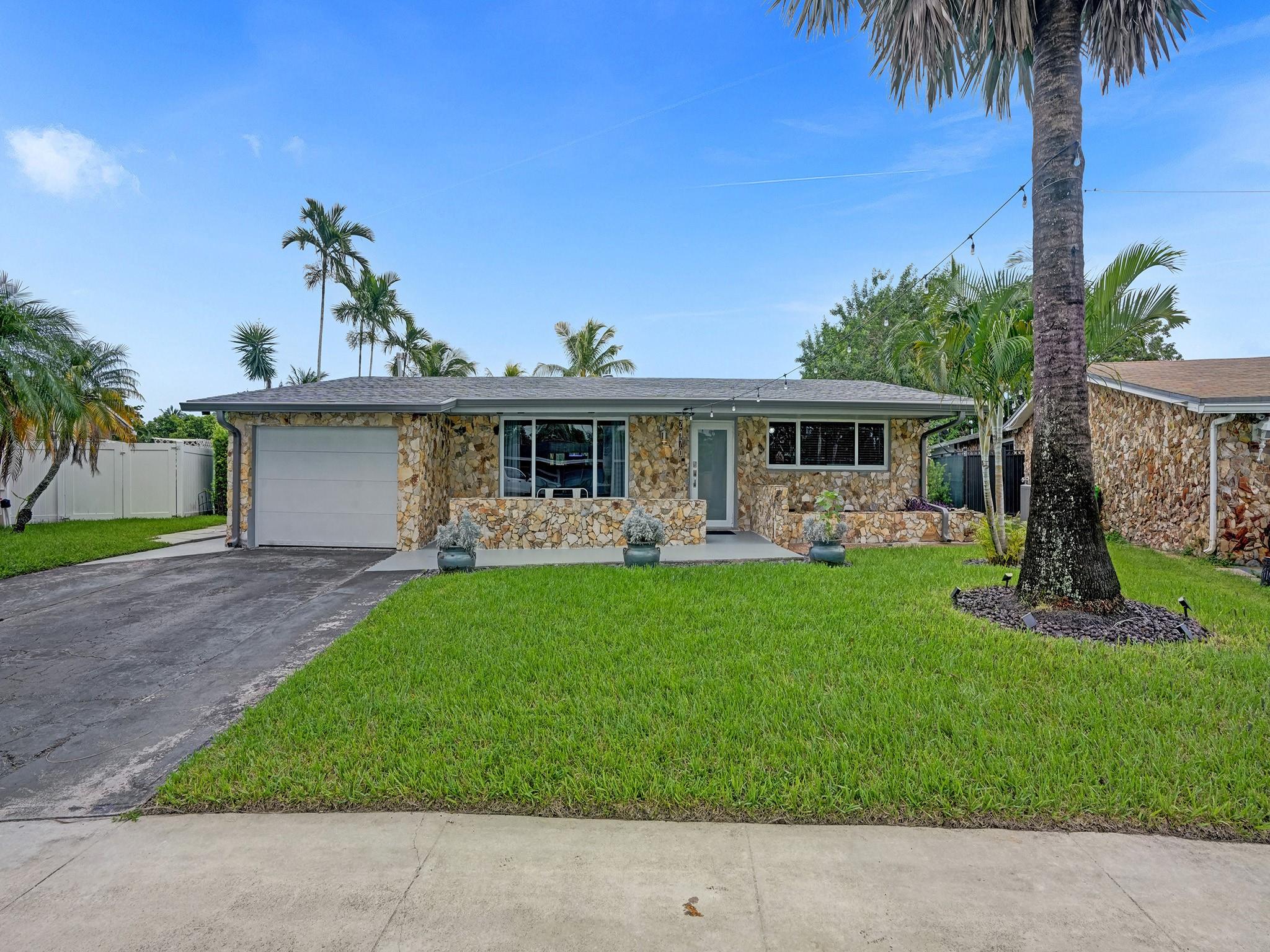 All your dreams just came true! As soon as you walk in you will fall in love! Enjoy your morning coffee on the inviting patio overlooking beautiful pool area, peaceful water views and expansive back yard. Ceramic tile throughout. Large master bedroom with walk in closet and extra A/C.  2nd bath features jacuzzi tub! Large open eat in kitchen, pantry and Newer appliances. Brand new roof  (2 months),  A/C 2 years old. Hurricane impact windows and doors throughout. Newer Washer and Dryer (2 years), Pool Diamond Brite 5 yrs old, New pool pump (2023). Patio and pool are screened with gorgeous pavered patio. Hot tub and some exterior lighting included! Sprinkler system feeds from the lake. Garage is partially converted with A/C. Can be 3rd bedroom, office, gym ect. Hurry before this one is gone!