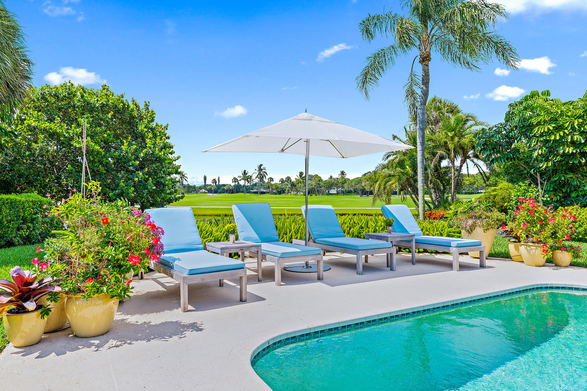 This serene and sunlit oasis on quiet Lake House Drive enjoys long and fabulous views across water, green range and fairways. Light and bright interiors with three bedrooms plus den with built-ins surround you with sun-drenched easy living.

The living room, family room, kitchen and dining room all overlook the wall of windows and French doors to the large patio and pool area, with plenty of entertaining space inside and out that enjoy the spectacular views. The large master suite with lovely terrace and vista views will not disappoint the senses. 

This warm and inviting sanctuary enjoys privacy and is a truly relaxing getaway from it all.  Just put your feet up and enjoy!  All this just a short bike ride to the Beach Club and facilities.