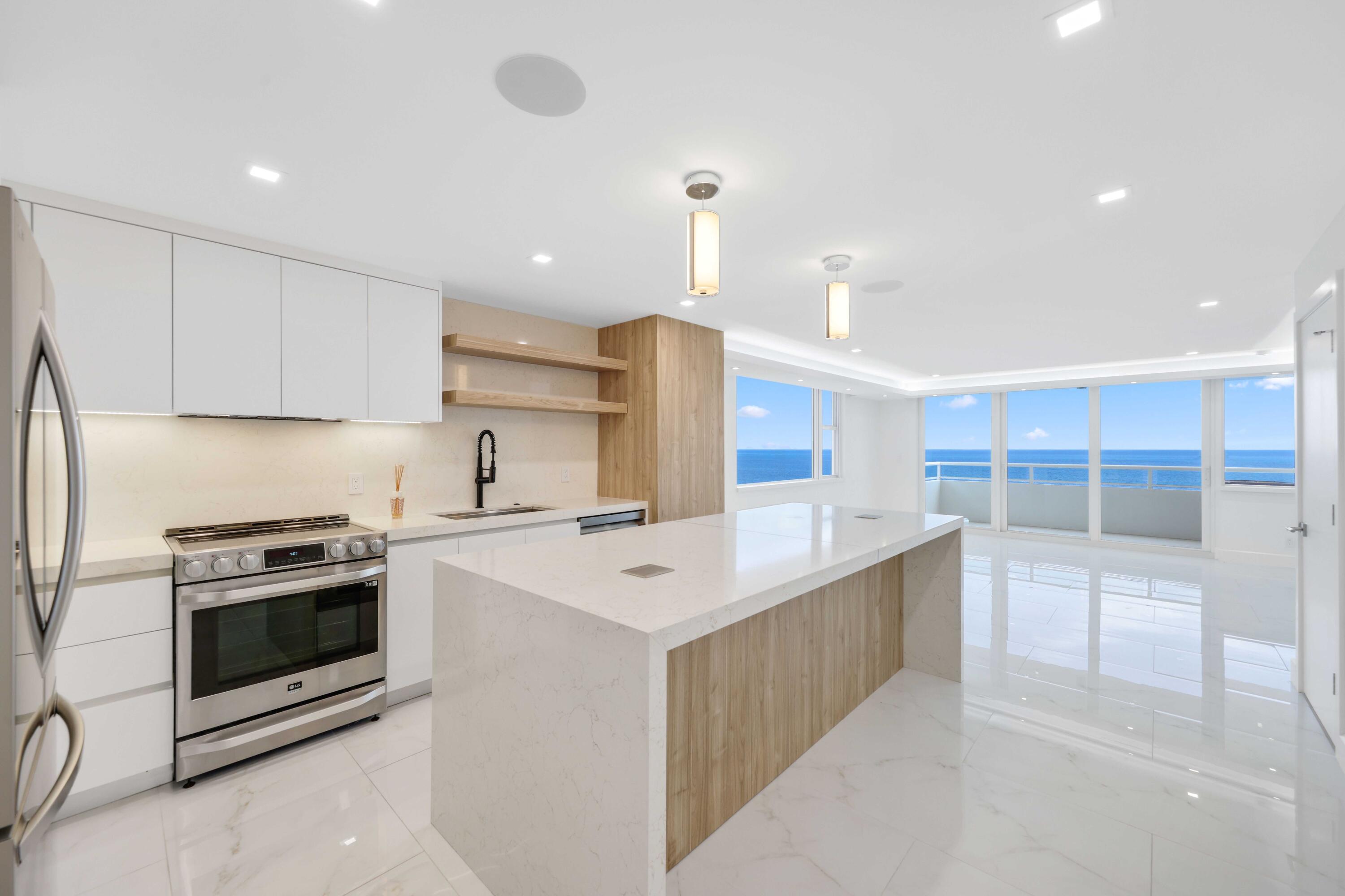 Welcome to Penthouse 1701 at Illini Condominium, a completely renovated corner residence excellently positioned on the 17th floor with breathtaking direct east-facing views of the Atlantic Ocean and sweeping vistas down A1A. This beautifully appointed one-bedroom, one-bathroom residence combines sophisticated modern design with an unbeatable Fort Lauderdale Beach lifestyle.  Natural light pours into the open-concept living space through expansive windows showcasing both eastern and northern exposures. The thoughtfully redesigned interior features tile flooring throughout, elegant cove lighting, built-in ceiling speakers, and a striking custom wood accent wall that creates a warm yet contemporary atmosphere. The designer kitchen is equipped with LG stainless steel appliances, a spacious center island with electrical outlets, making it ideal for both everyday living and entertaining. A convenient in-unit Miele washer and dryer adds to the home's functionality.  The luxurious bathroom has been completely renovated and features a separate soaking tub and walk-in shower, creating a spa-inspired retreat.  Located within the boutique, oceanfront Illini Condominium, residents enjoy direct beach access and one of Fort Lauderdale's most desirable locations. Step outside to the beach, waterfront dining, cafés, and vibrant nightlife, with the city's finest restaurants just moments away. Las Olas Boulevard, world-class shopping, marinas, and downtown Fort Lauderdale are all less than five minutes away, offering the perfect blend of beachfront living and urban convenience.  Experience elevated coastal living from this exceptional penthouse residence, where panoramic ocean views, designer finishes, and an unparalleled location come together to create a truly special offering.